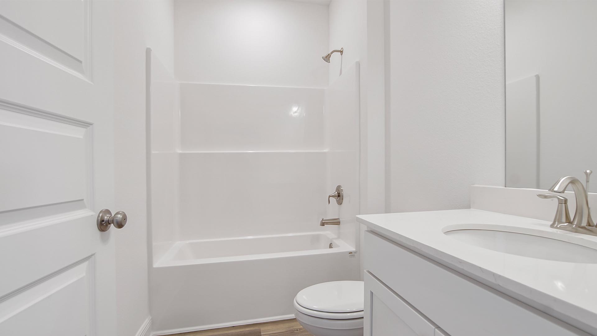Shared bathroom features quartz countertops and a single vanity