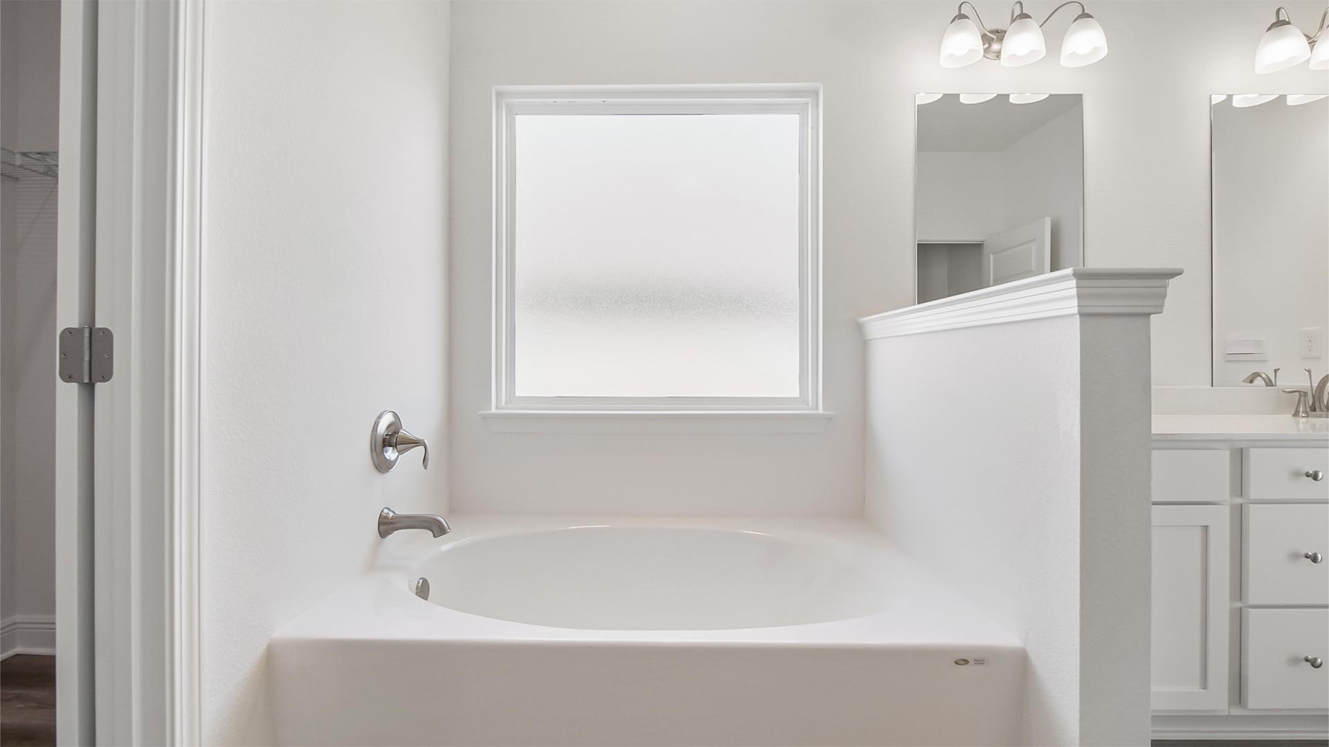 Large soak tub adds to the spa feeling of the primary bathroom