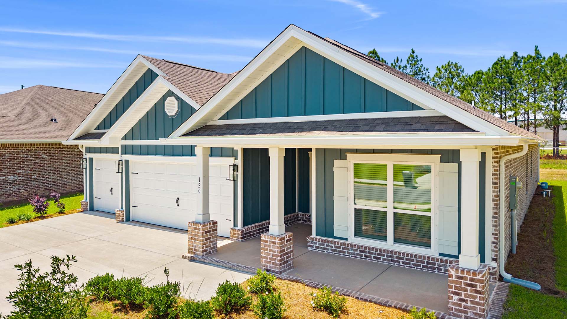 This home has a three car garage and covered front porch