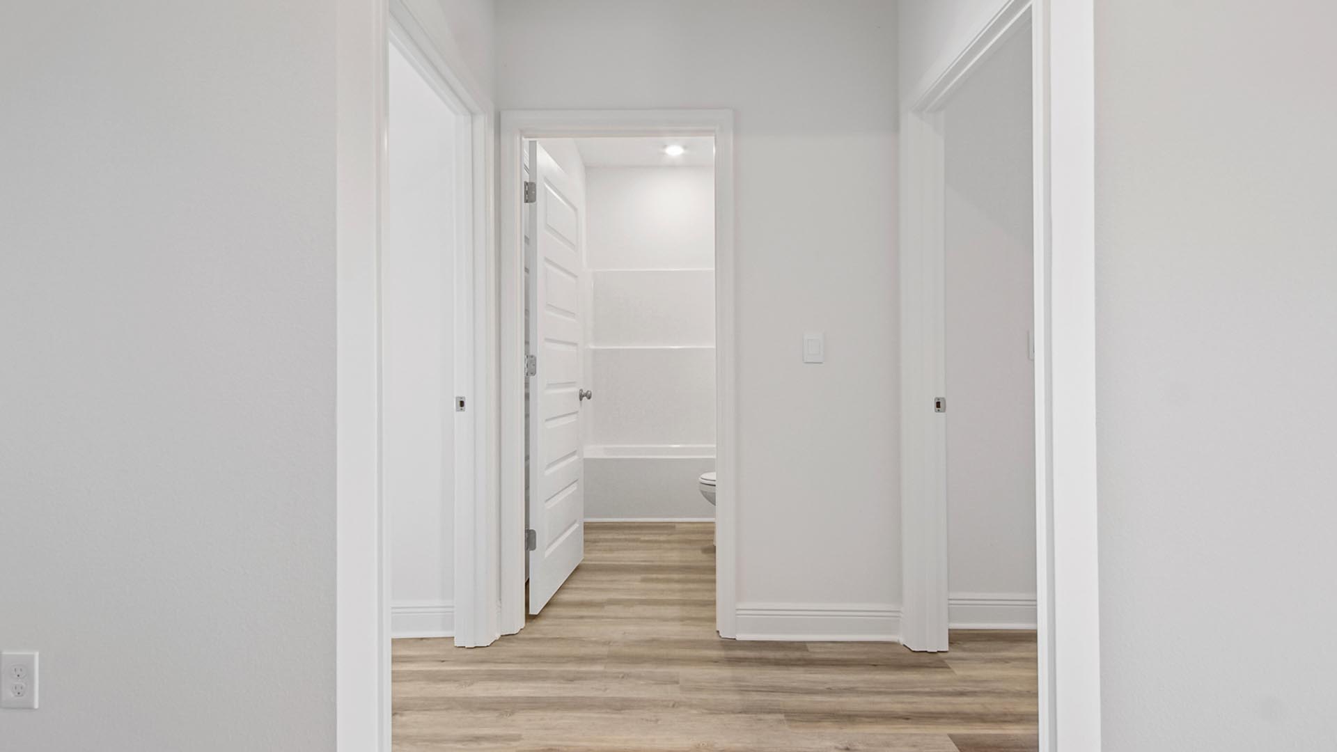 Hall leading to the shared bathroom and bedrooms two and three