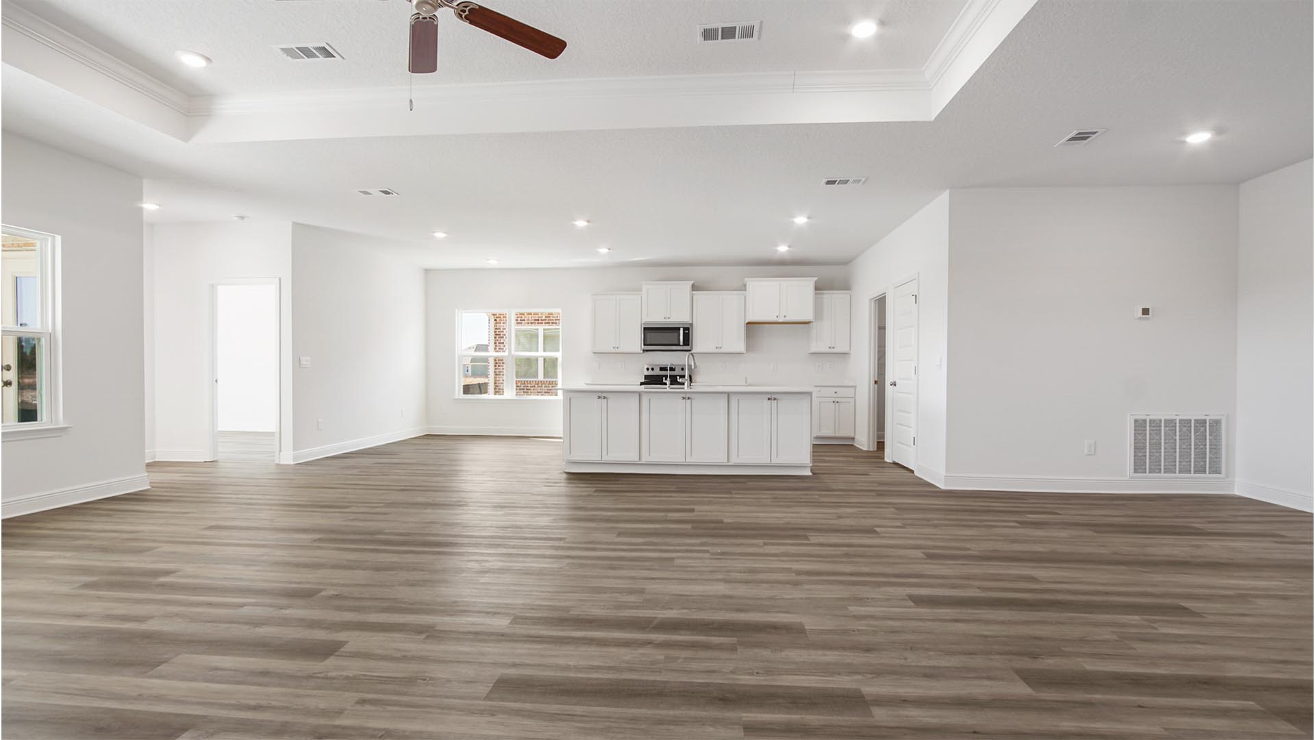 The living area of the Destin floor plan features trey ceilings