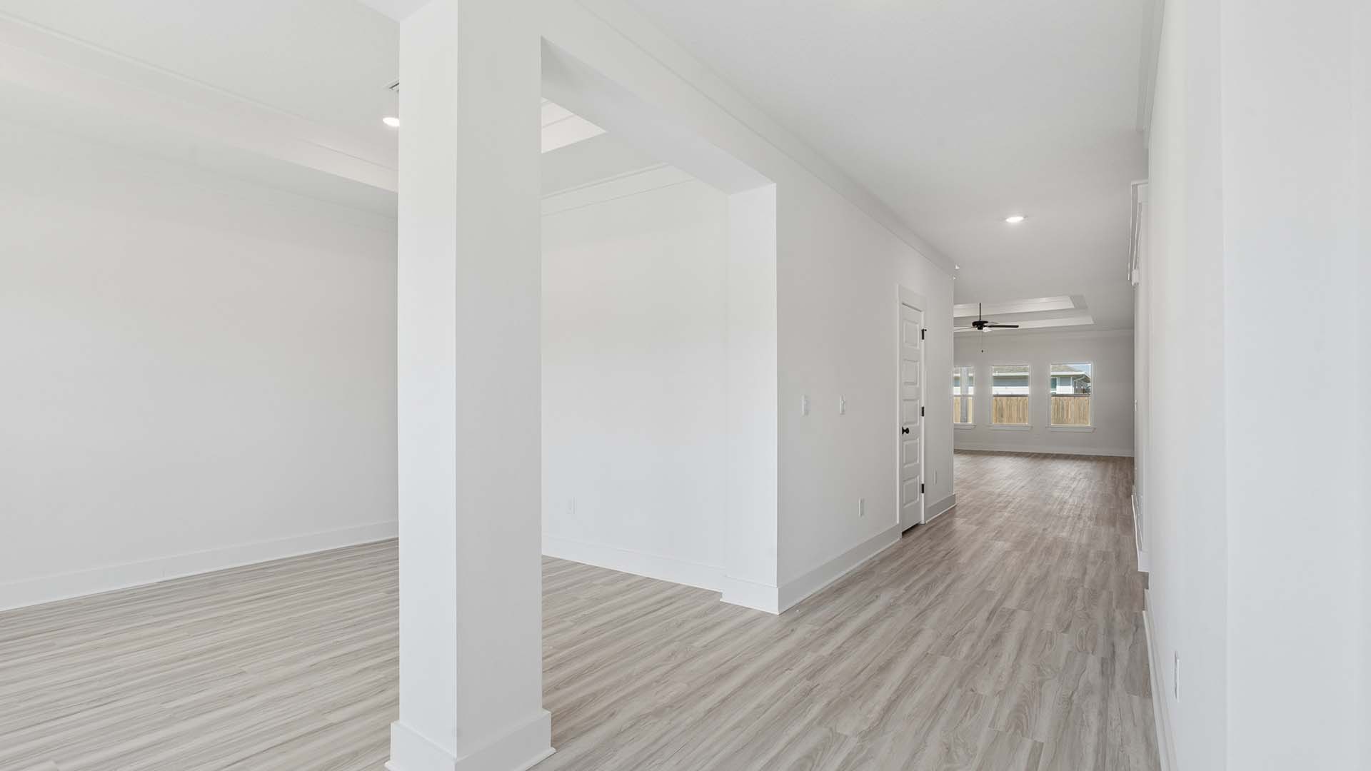 Entry to the home with a formal dining room just off the entry hall