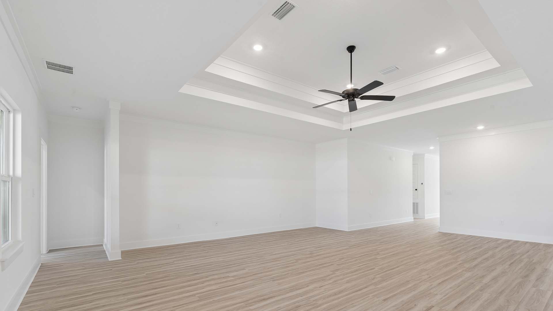 The living area has tray ceilings