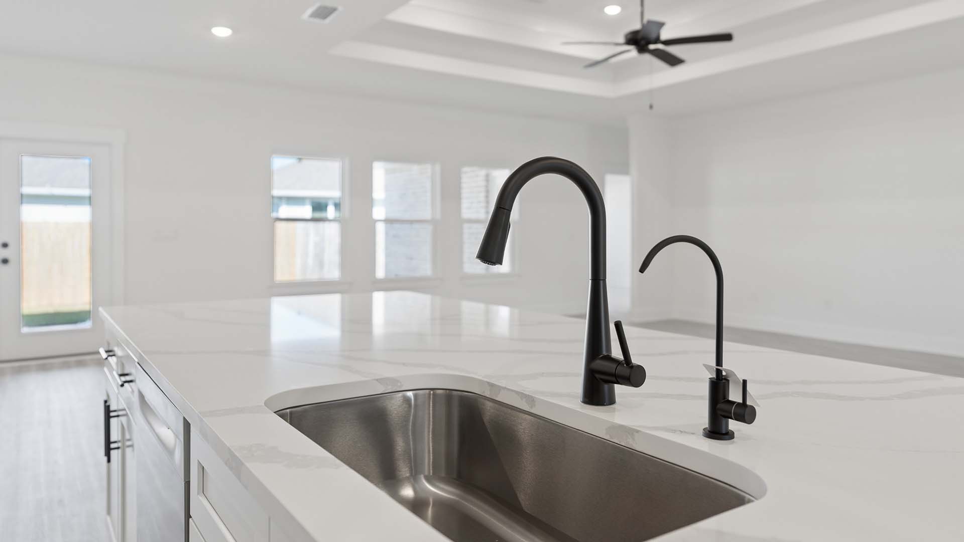The island has a sink and dishwasher for easy meal cleanup