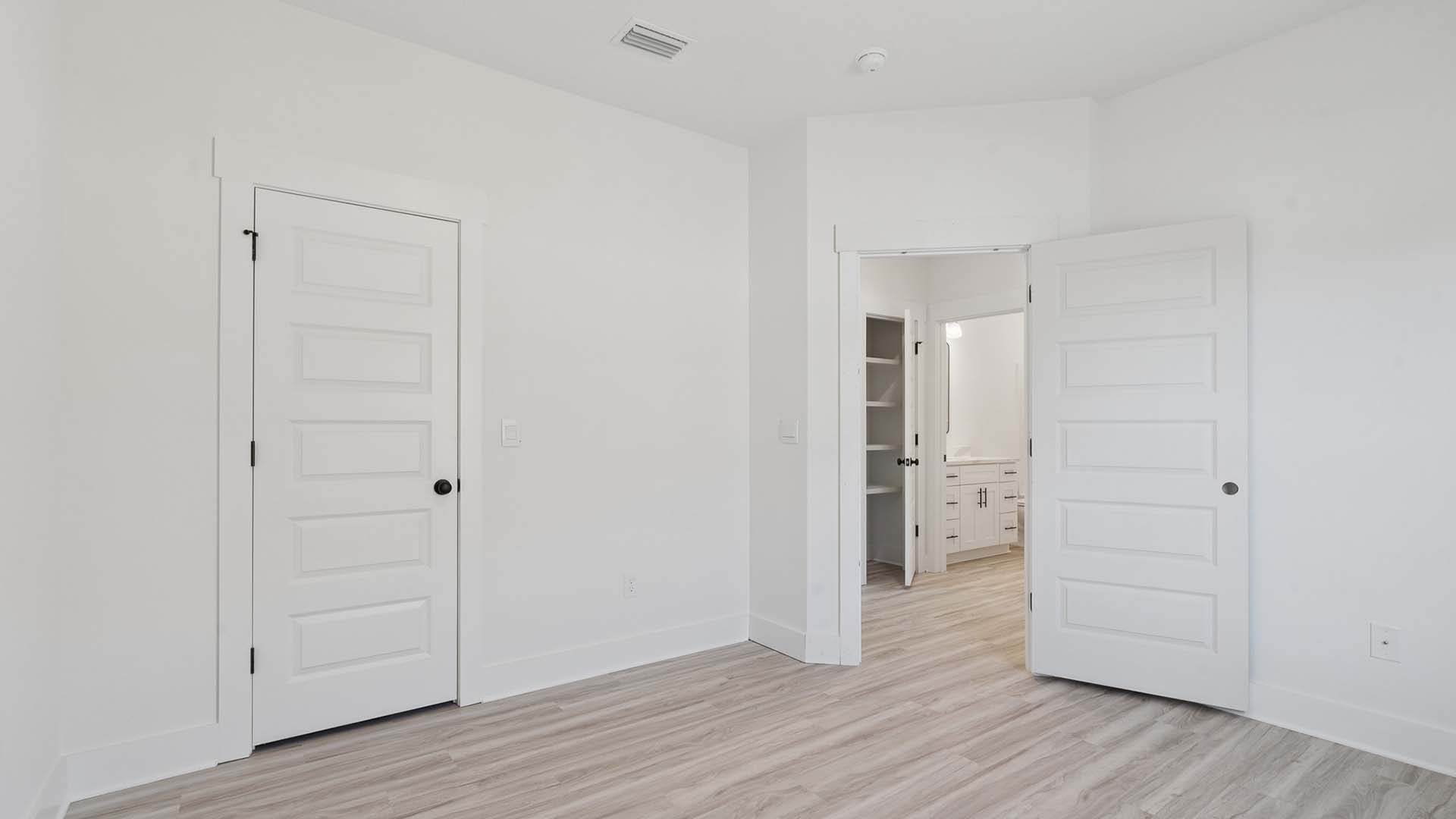 There are two additional bedrooms off the front entry hall