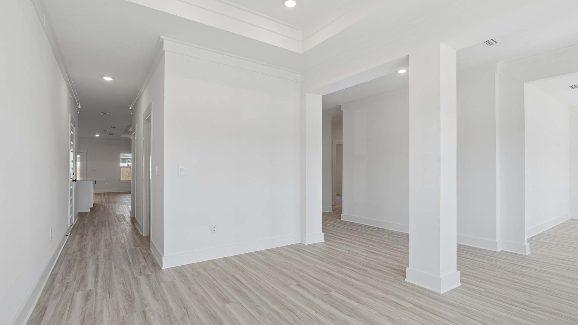 The formal dining room has a pass through hall that leads to the kitchen