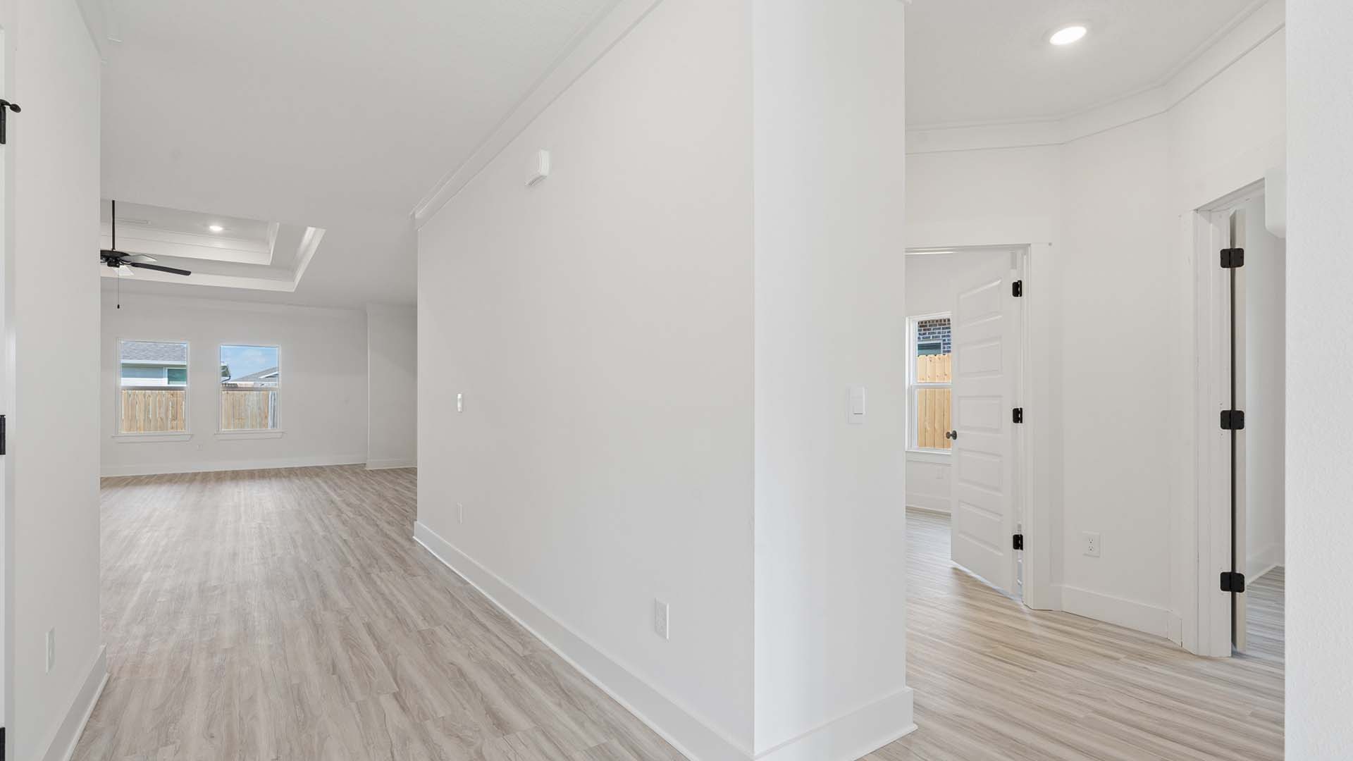 Off the entry hallway is a separate hall leading to two guest bedrooms