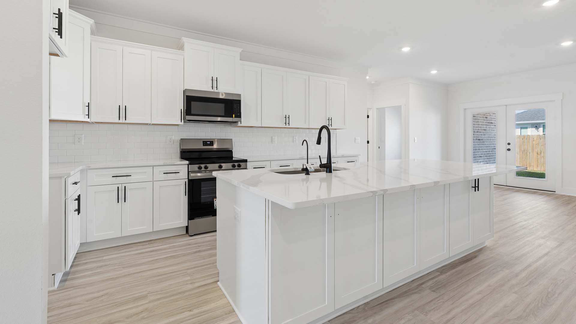 The kitchen is open to the living area and has a center island