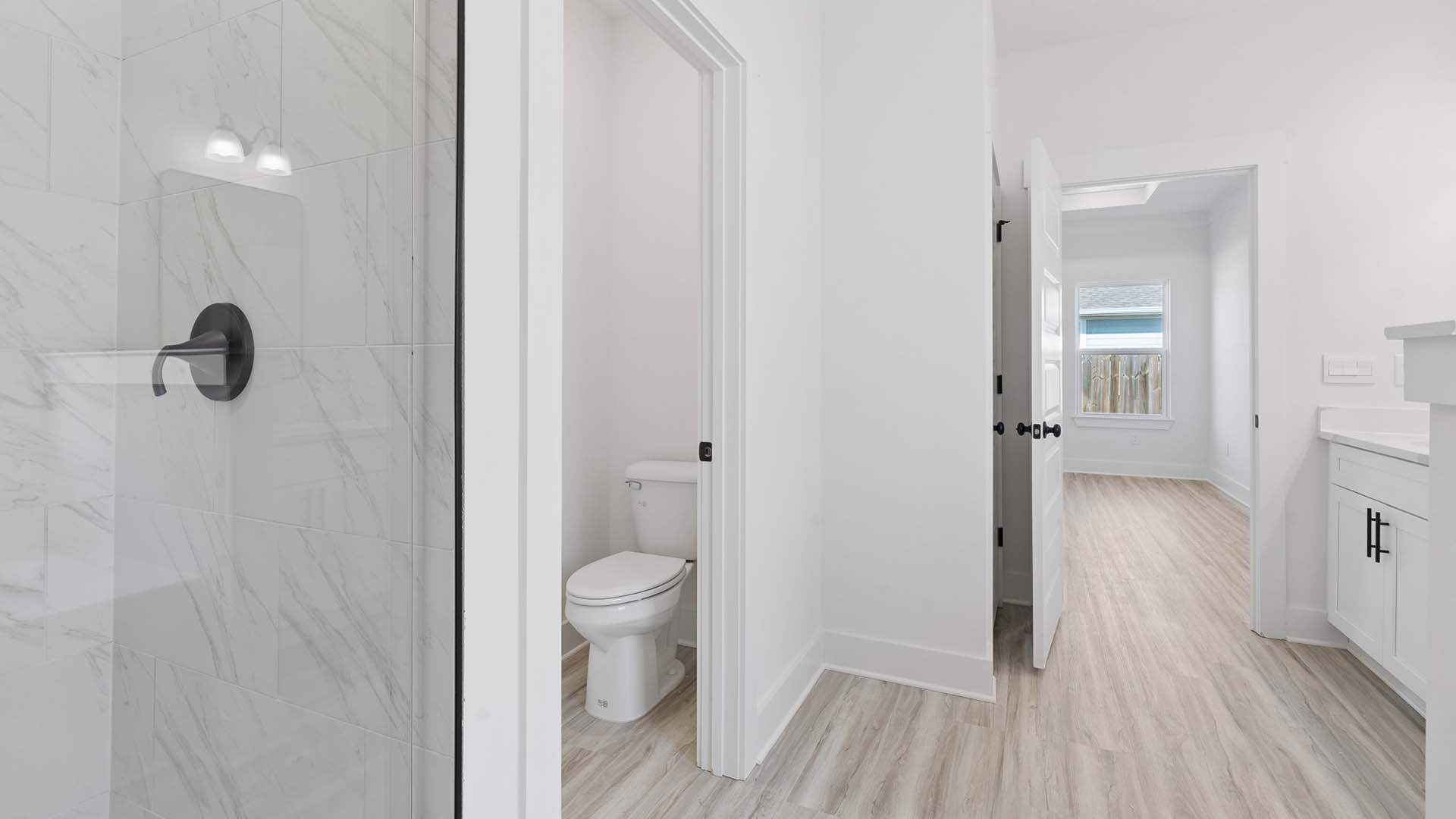 The primary bath has a separate closet for storage