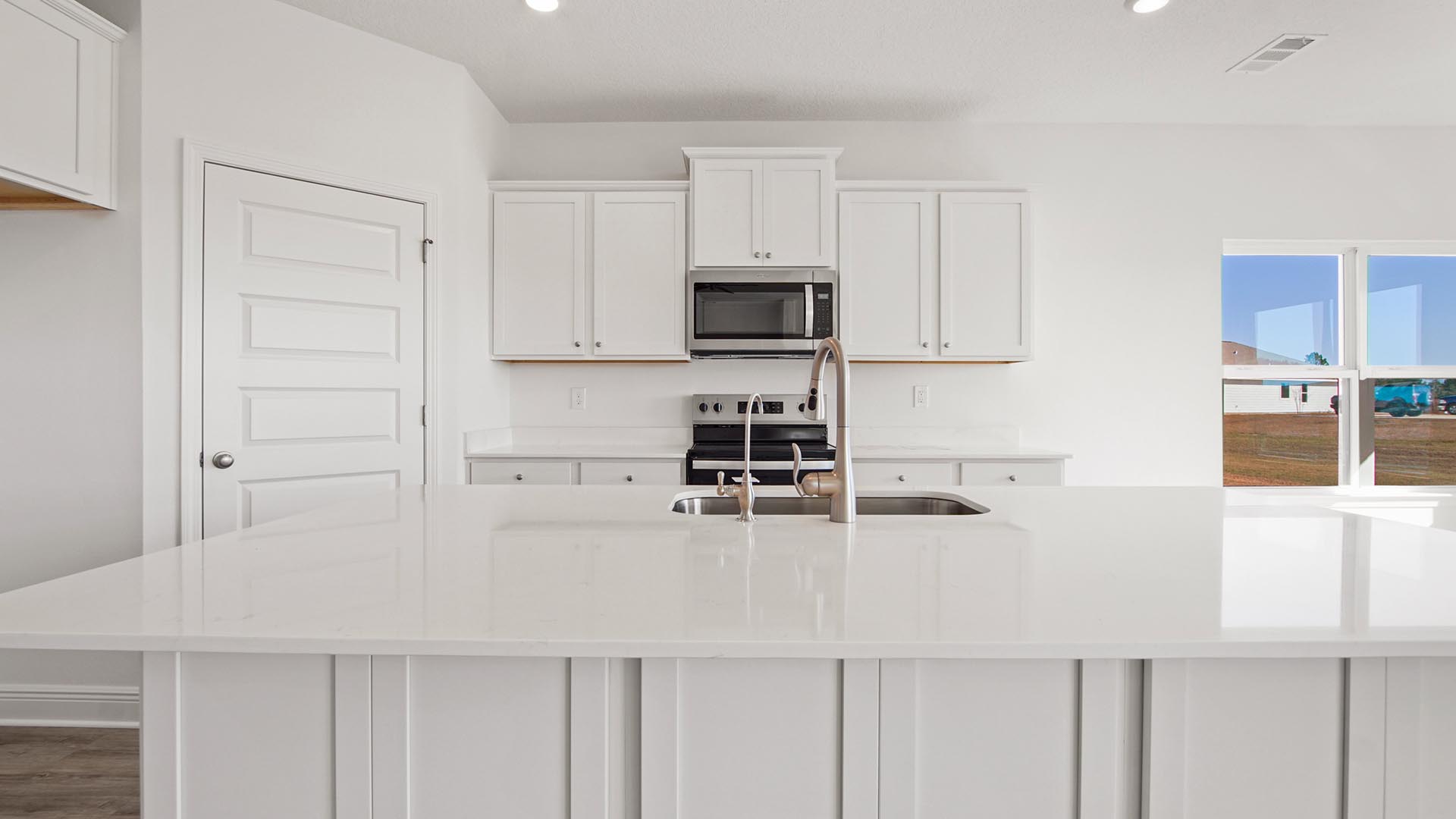 The open kitchen features a center island