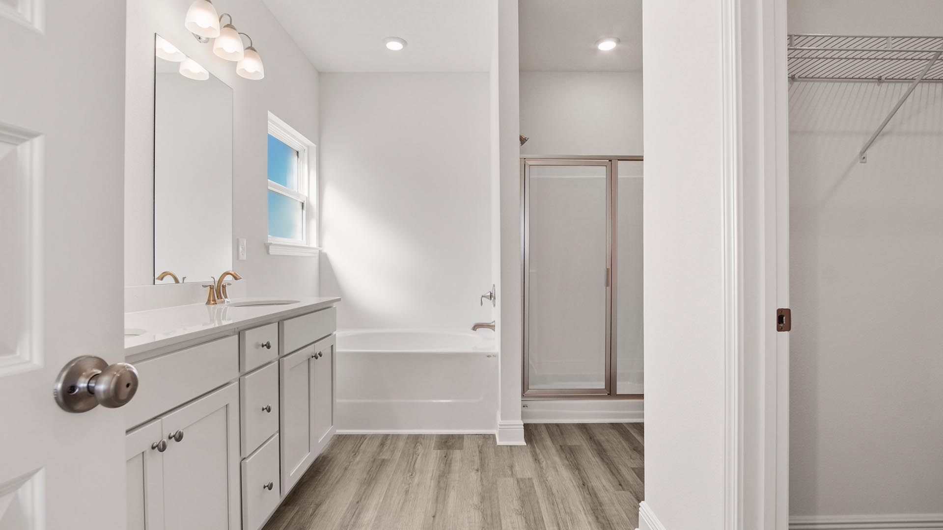 The primary bathroom has a vanity with dual sinks