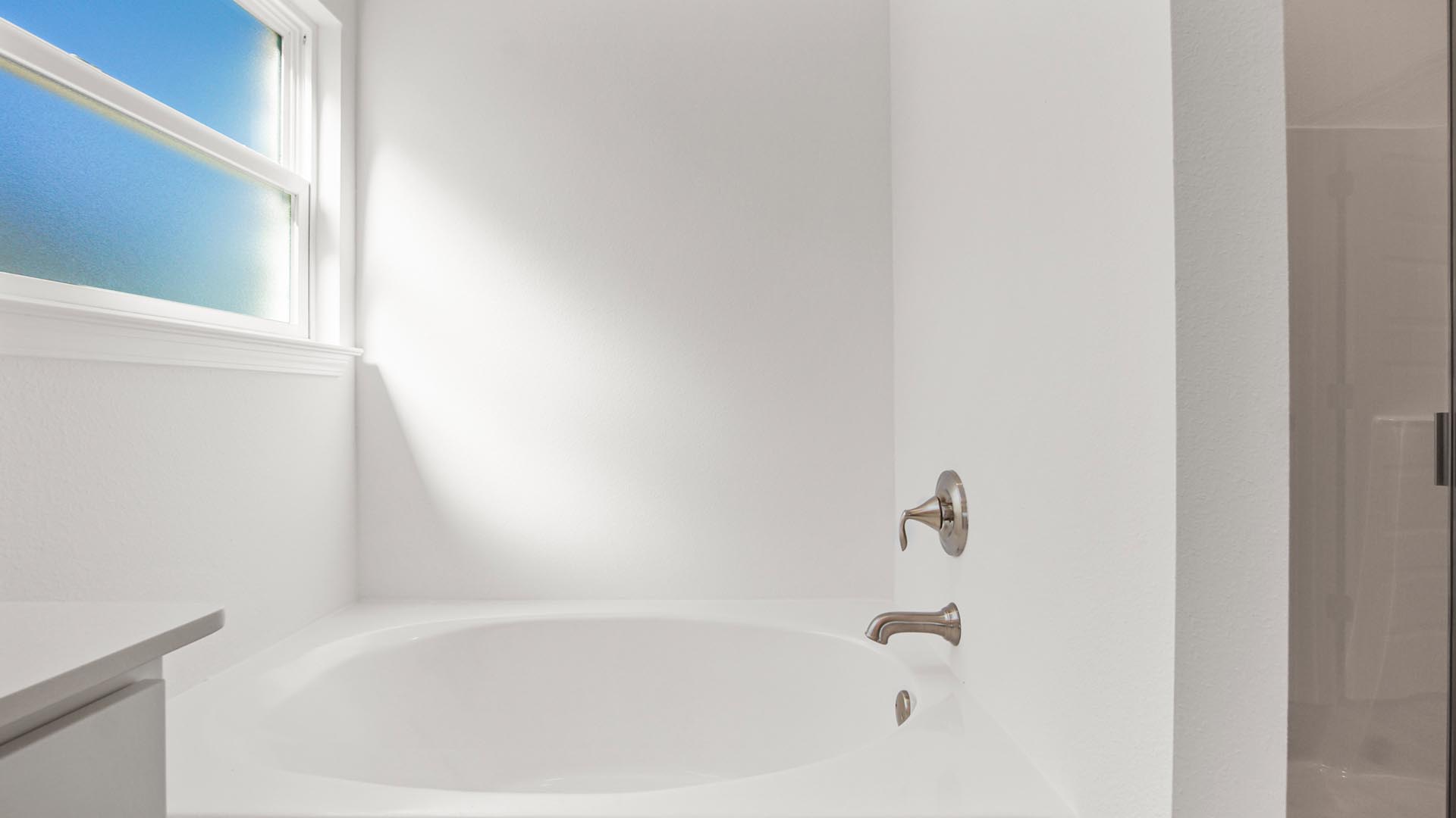 There is a soak tub in the primary bathroom