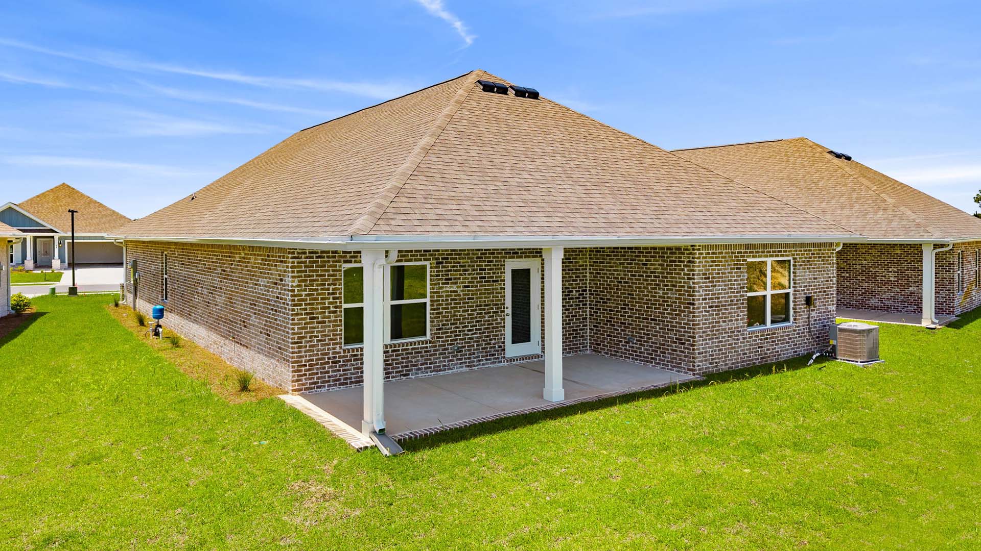 Spacious covered patio at the back of the home