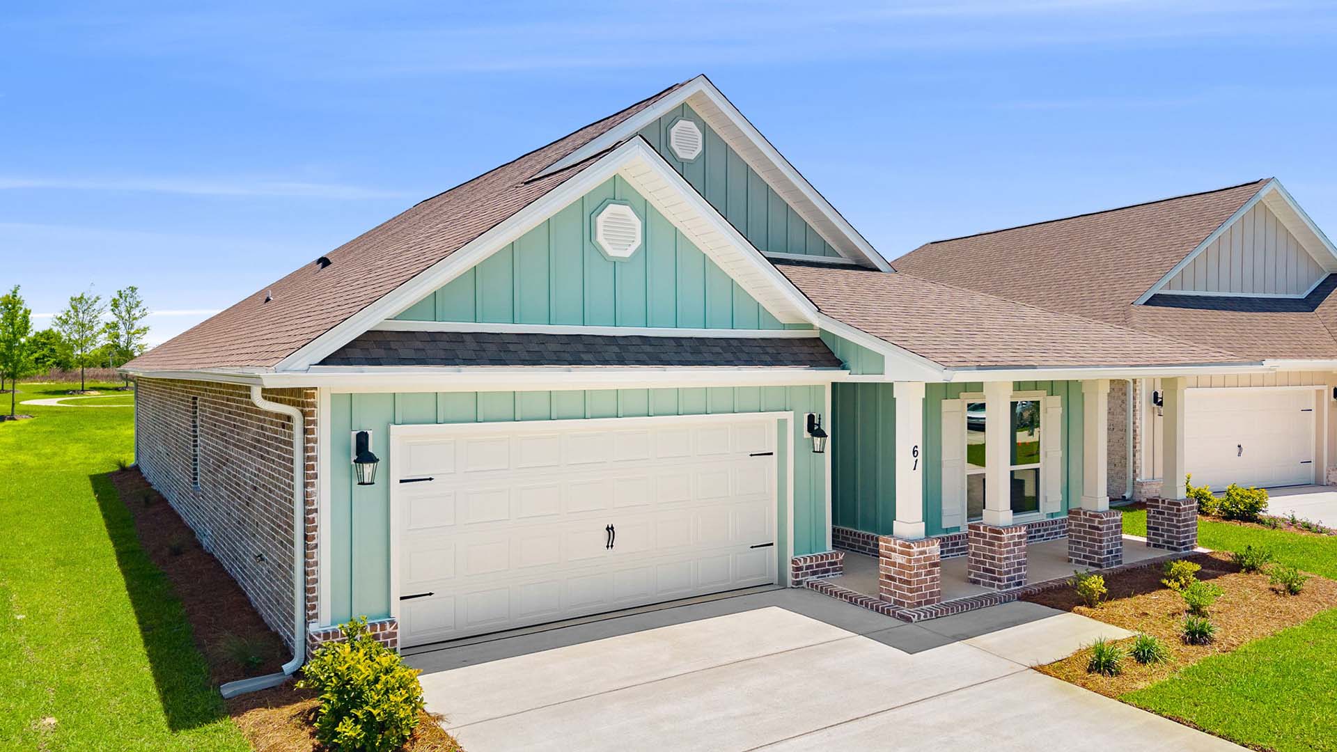 This home has a covered front porch and a two car garage