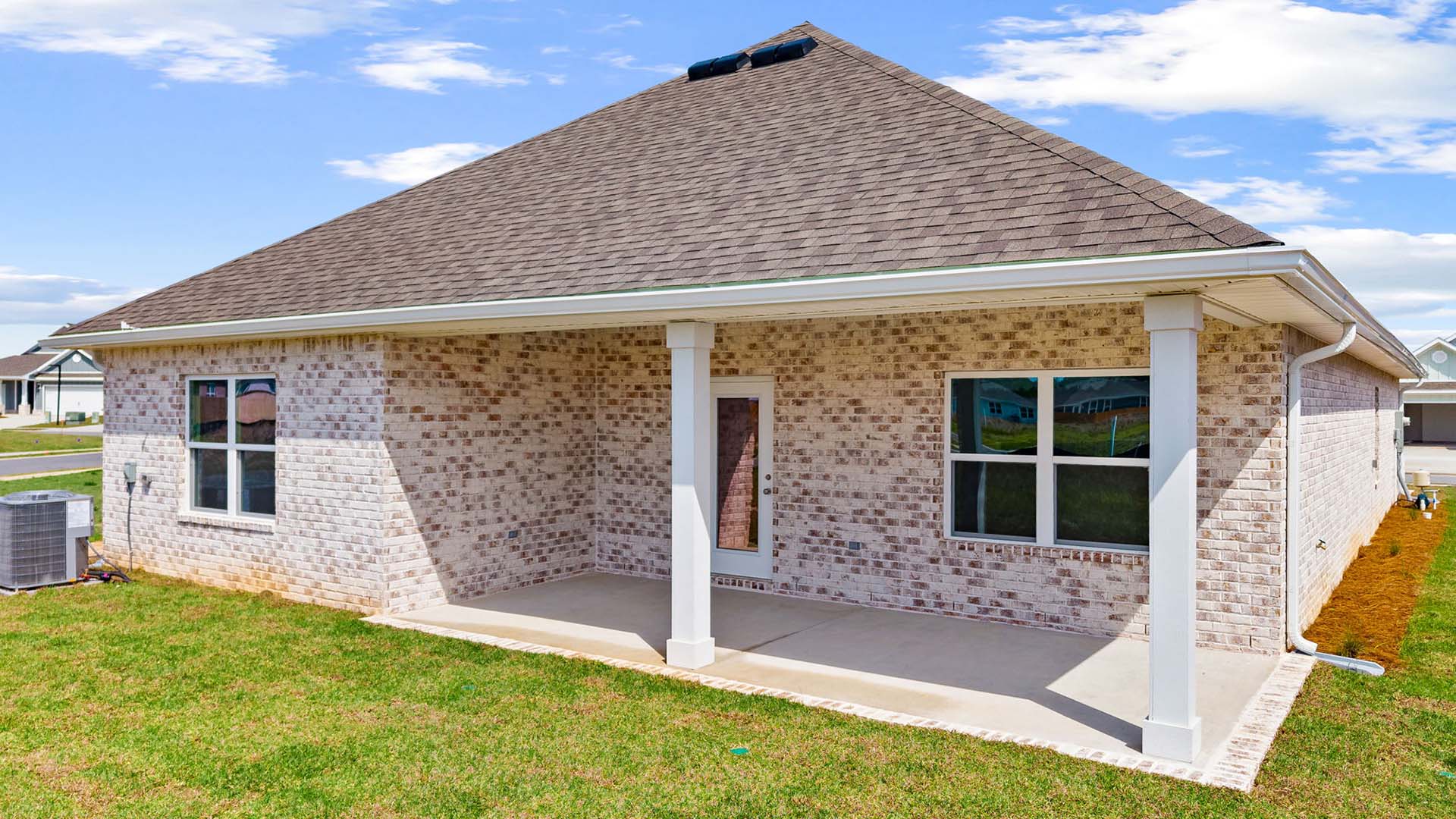 The covered patio has space for dining area or lounge area