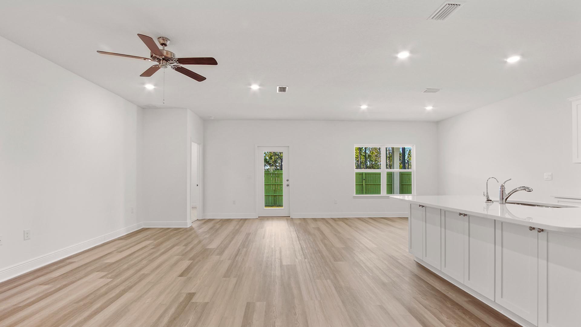 Open concept living area with EVP flooring