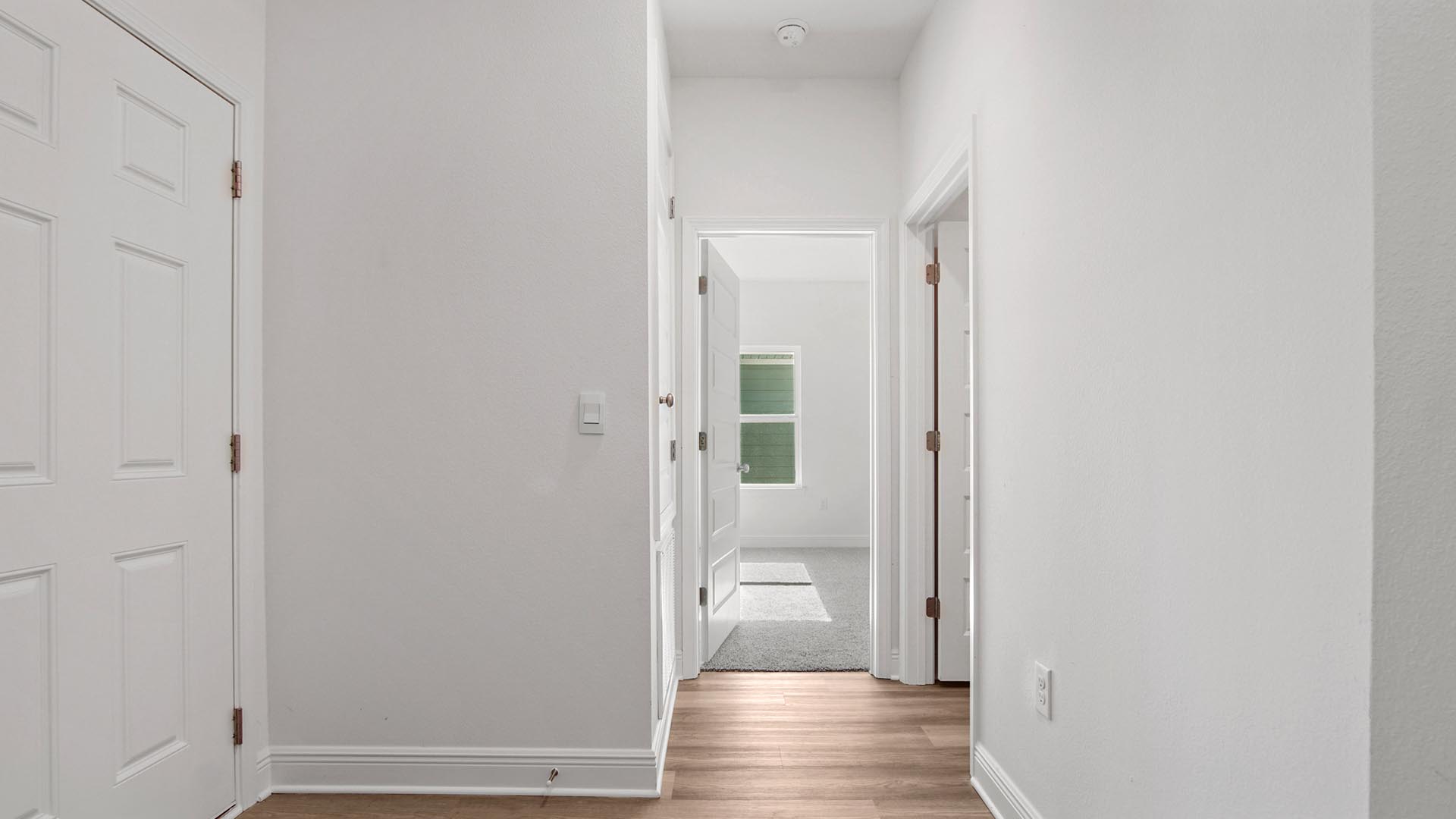 Hall leading to bedroom four and the laundry room