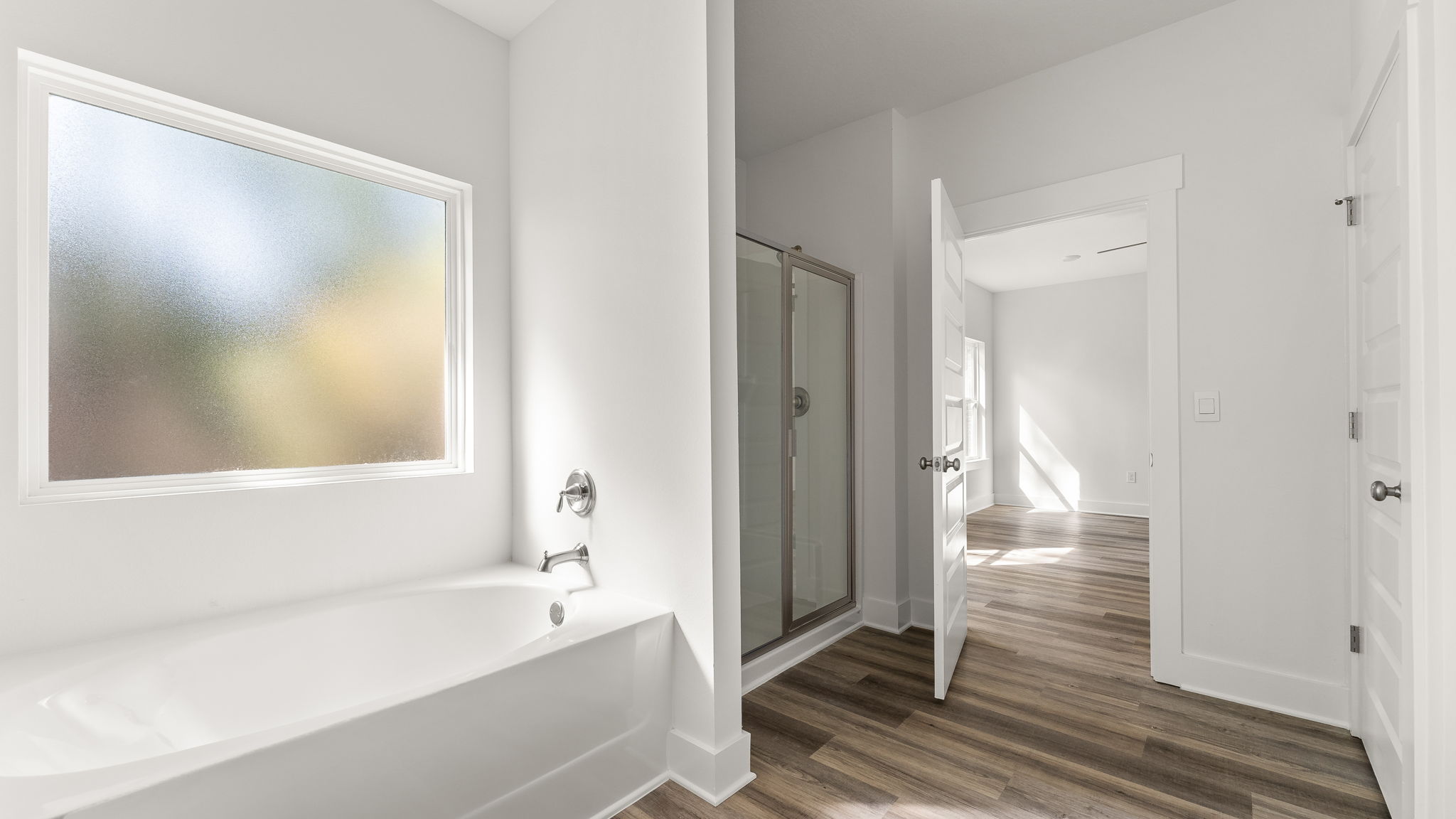 The primary bath has a shower and separate soak tub