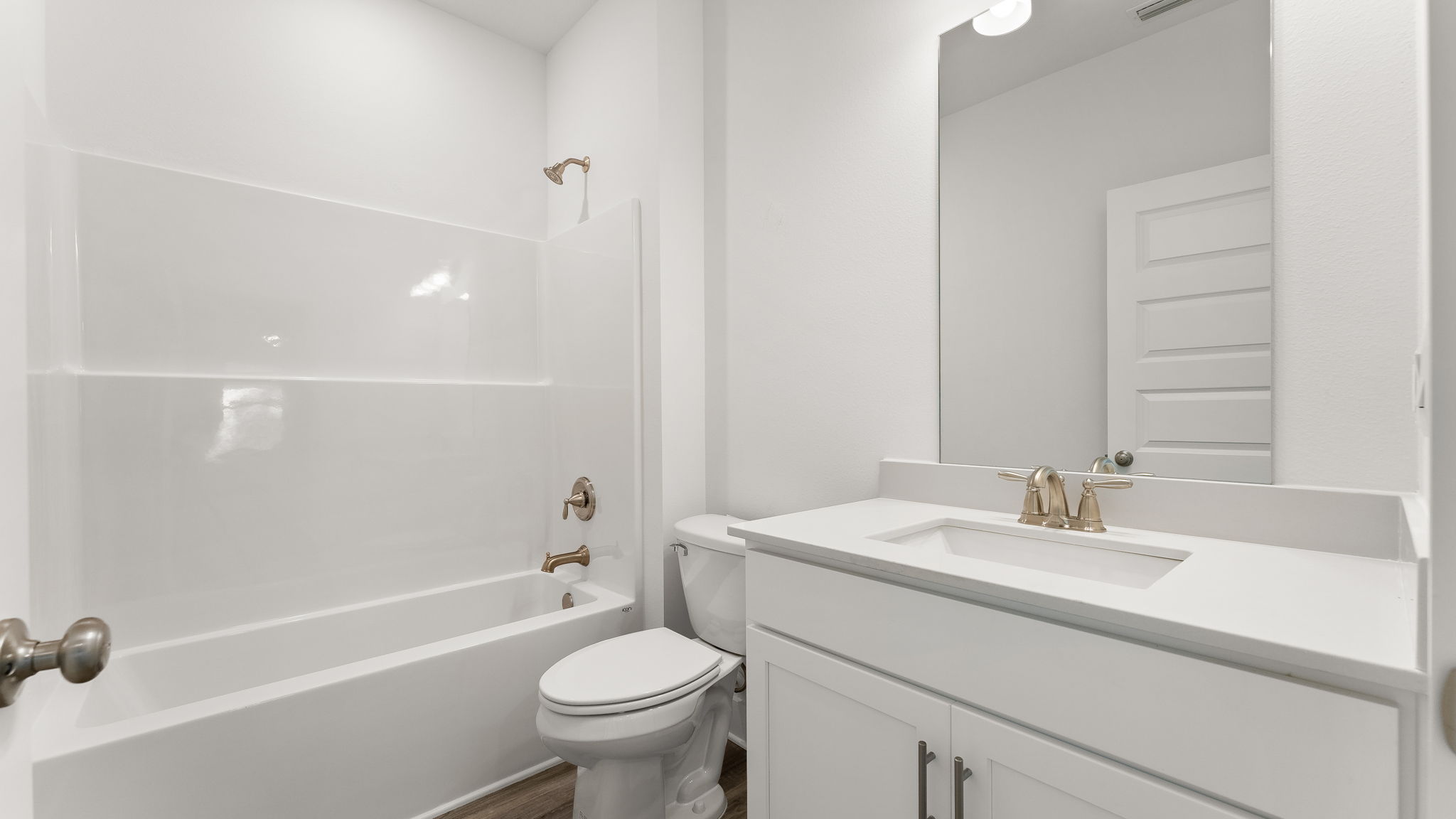 Three bedrooms share a full bath with shower tub combination