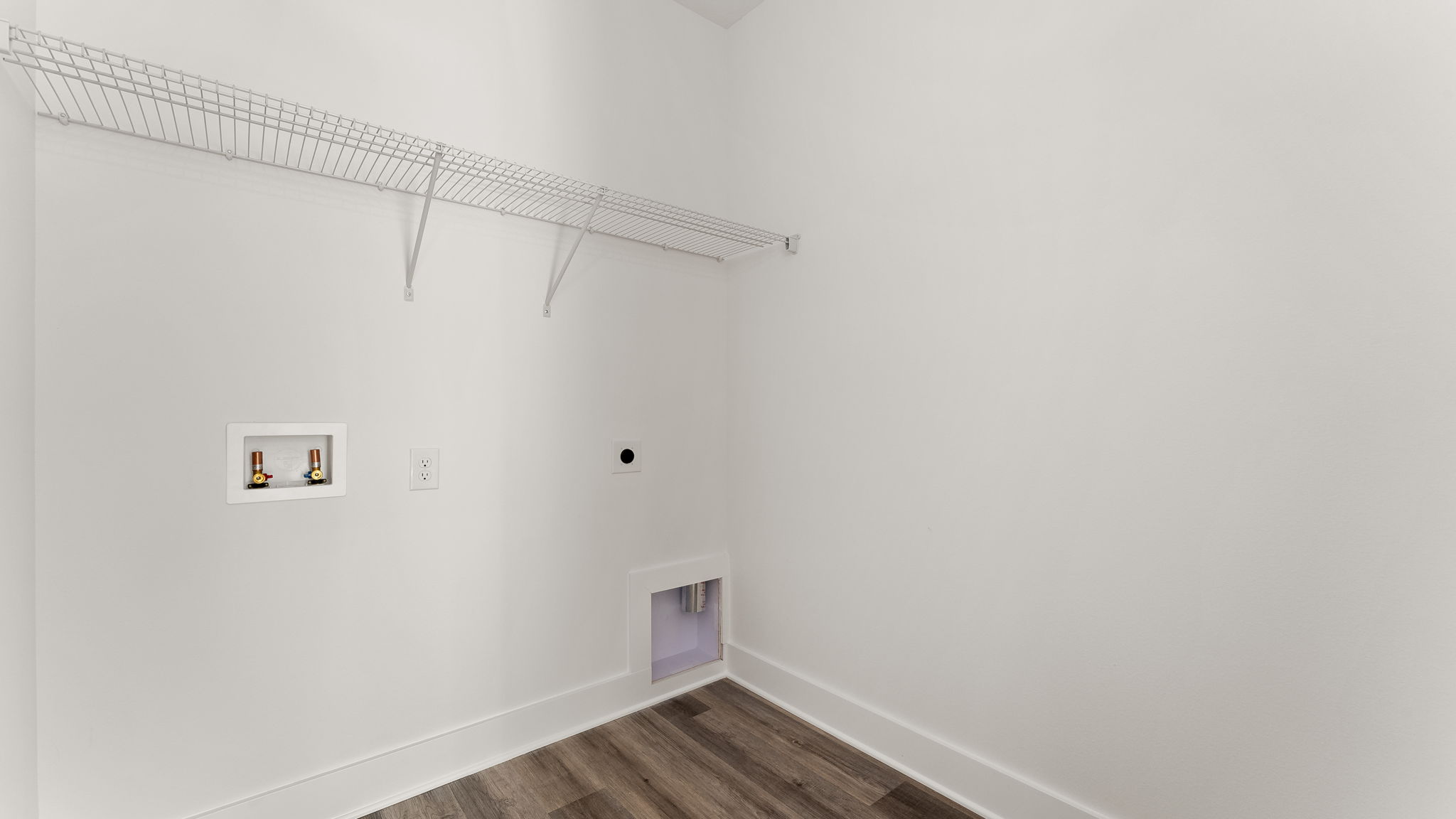 There is a nice size laundry room with hookup for full size washer and dryer