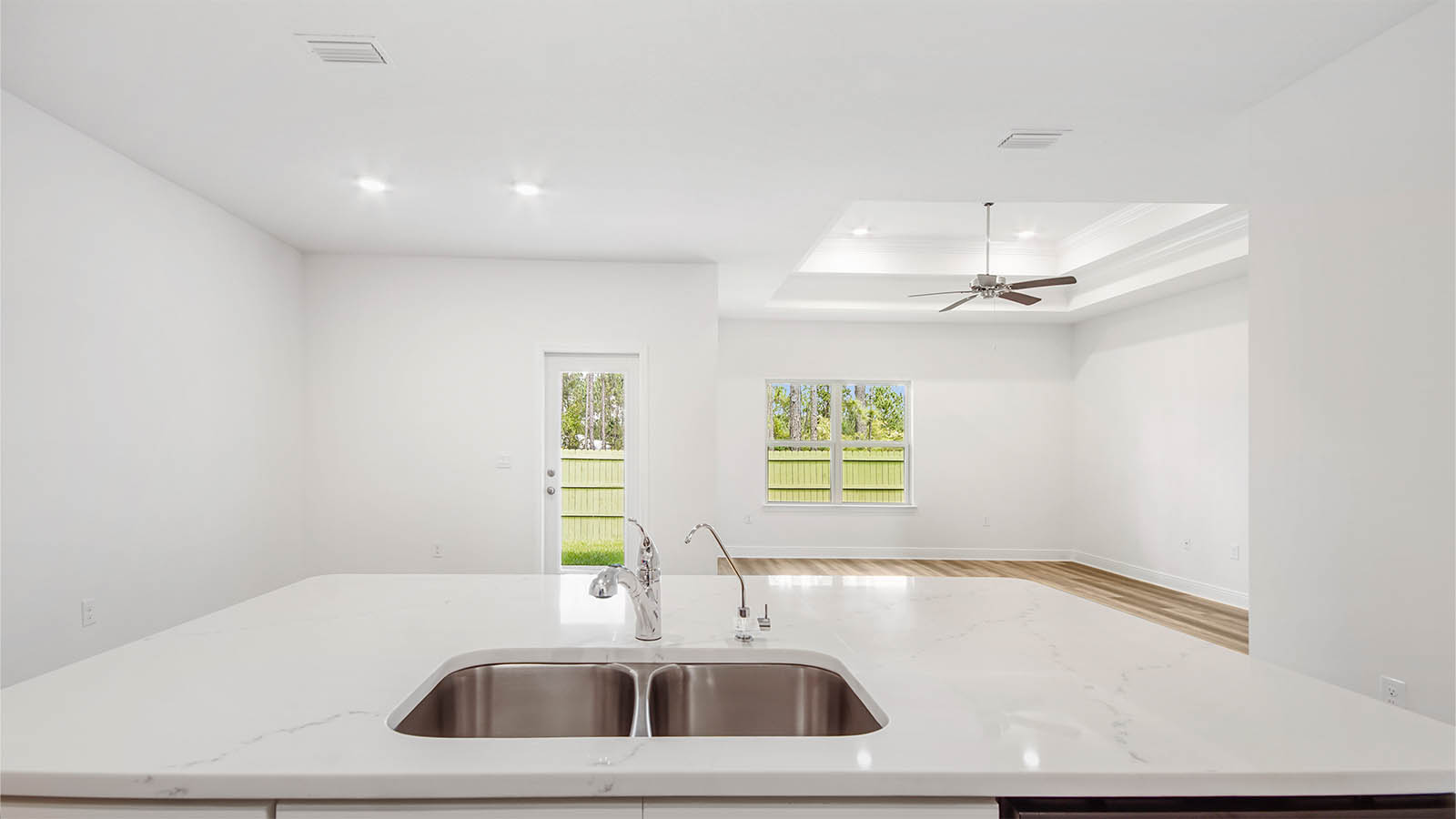 The island is equipped with a dishwasher for easy clean up