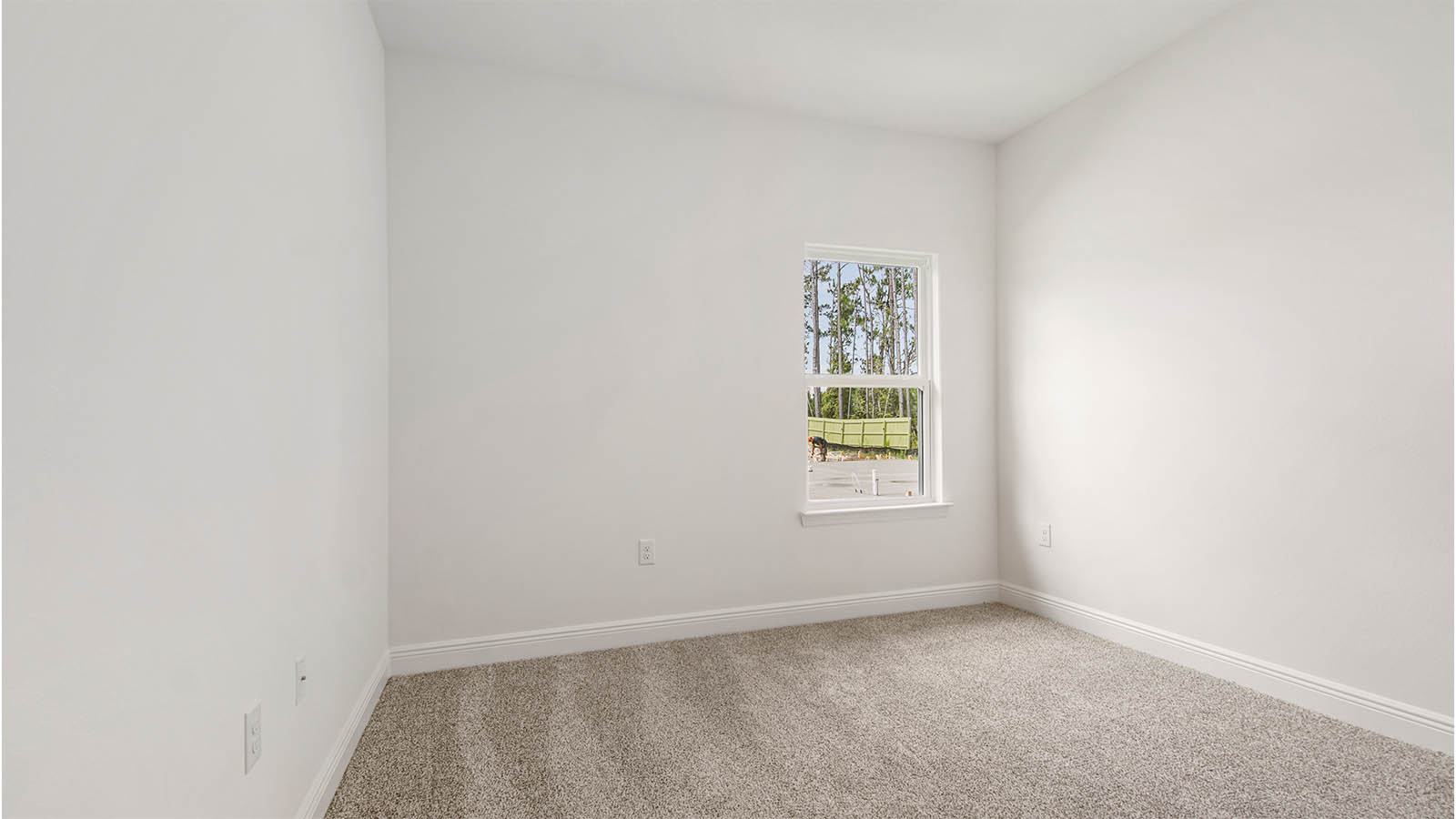 Additional interior bedroom with plush carpet