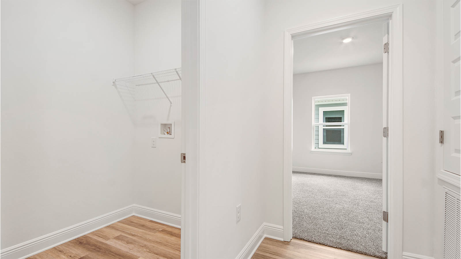 The laundry room has space for a full size washer and dry and additional storage