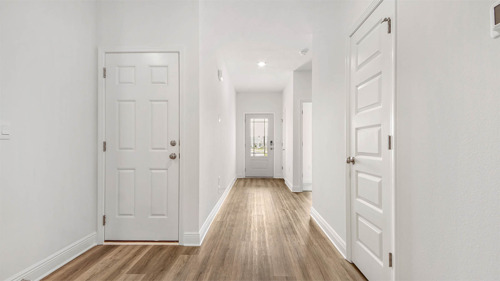 There are two guest bedrooms off the entry hall
