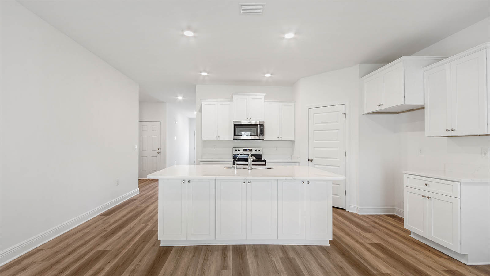 The center island in the kitchen has space for meal prep and service