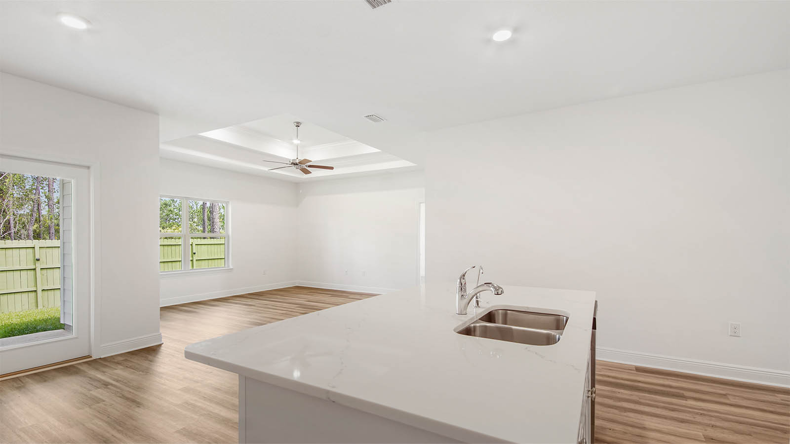 The center island has a stainless sink