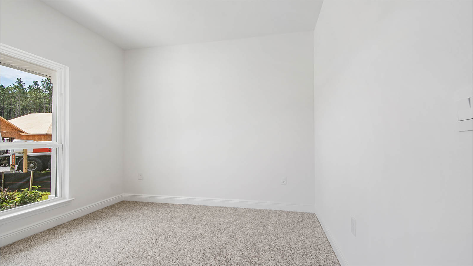 Additional bedroom with plush carpet