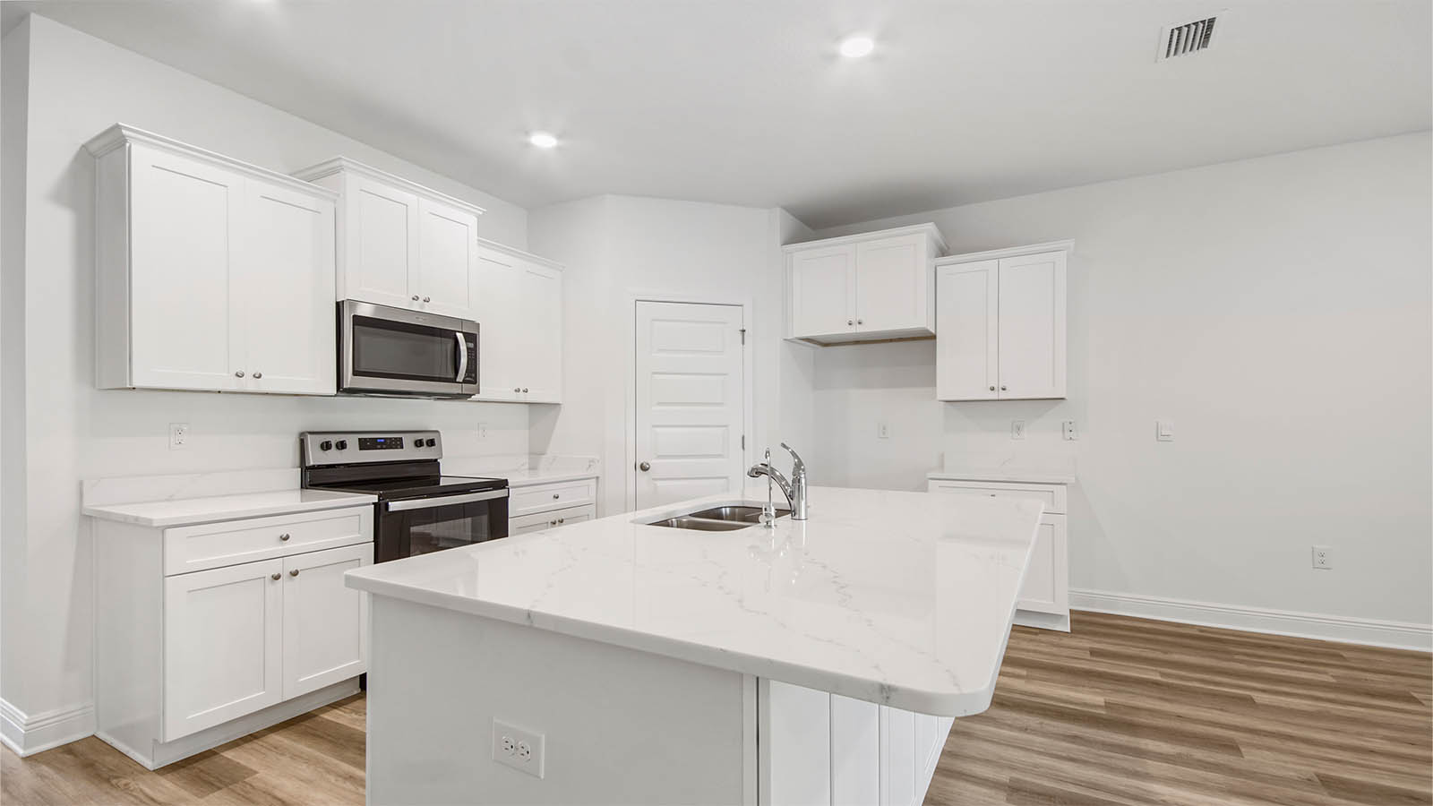 Beautiful quartz countertops with white upper and lower cabinetry