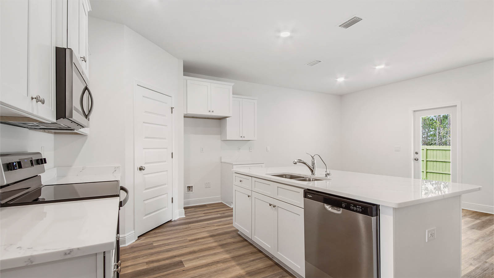The kitchen is open and spacious and features a center island