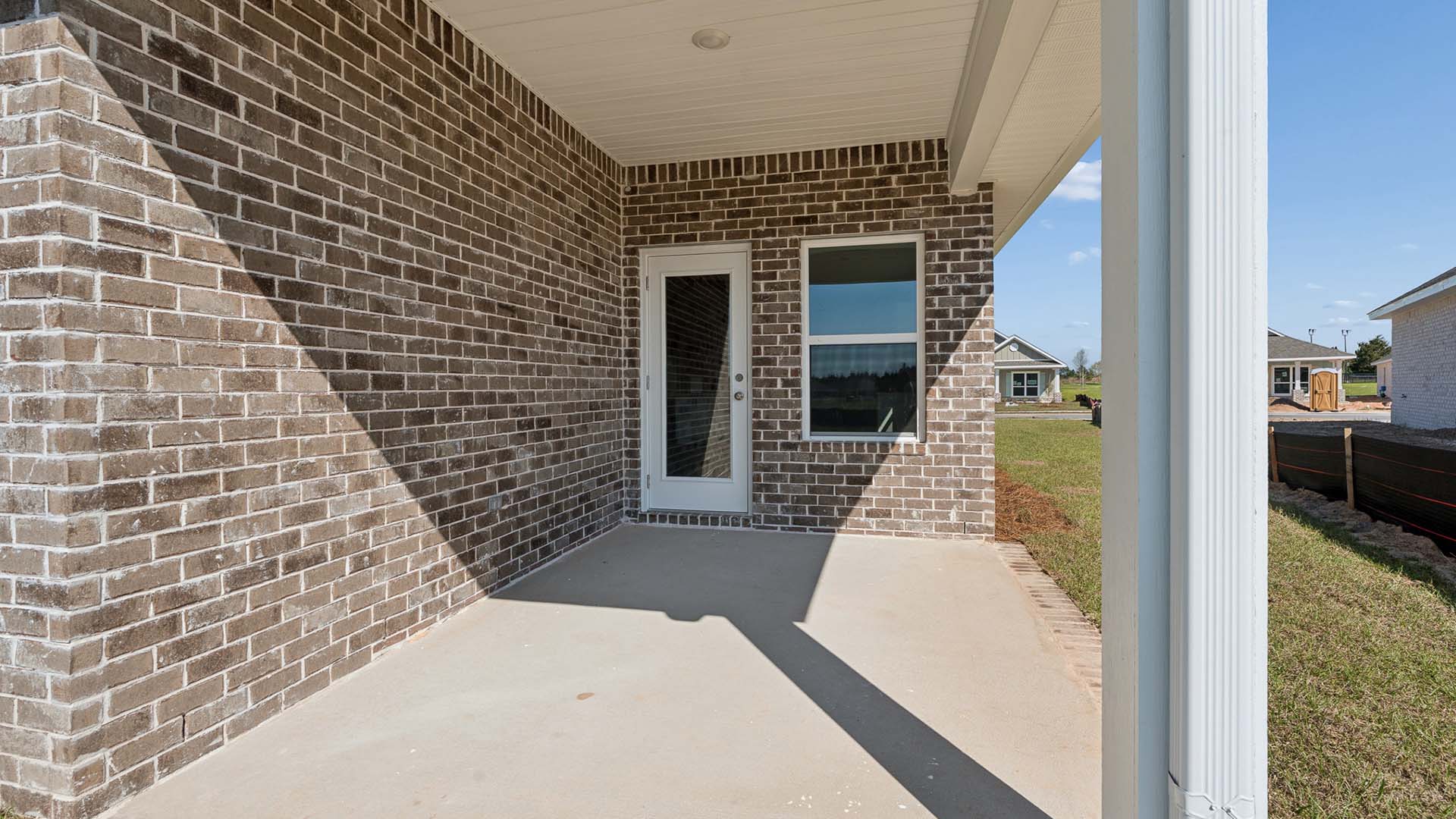 There is a covered patio at the back of the home