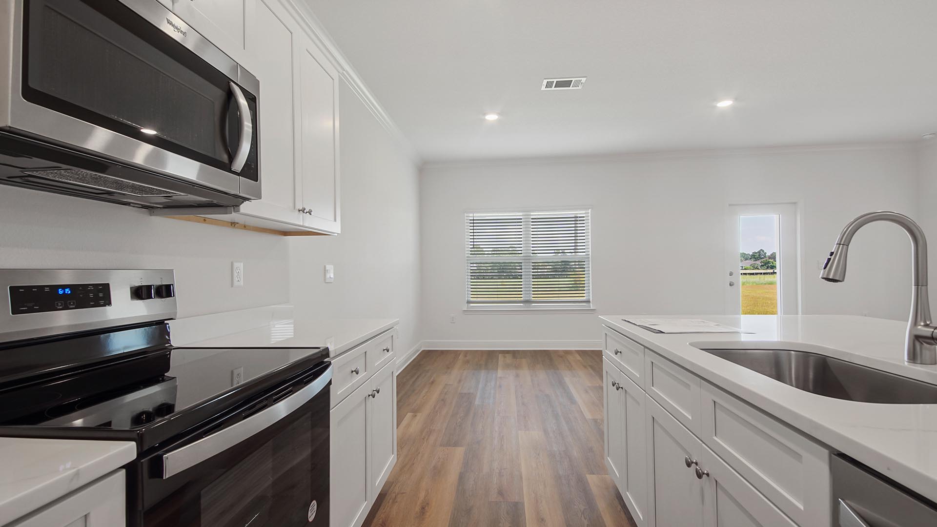 Appliances included in kitchen with a smooth top stove microwave and dishwasher