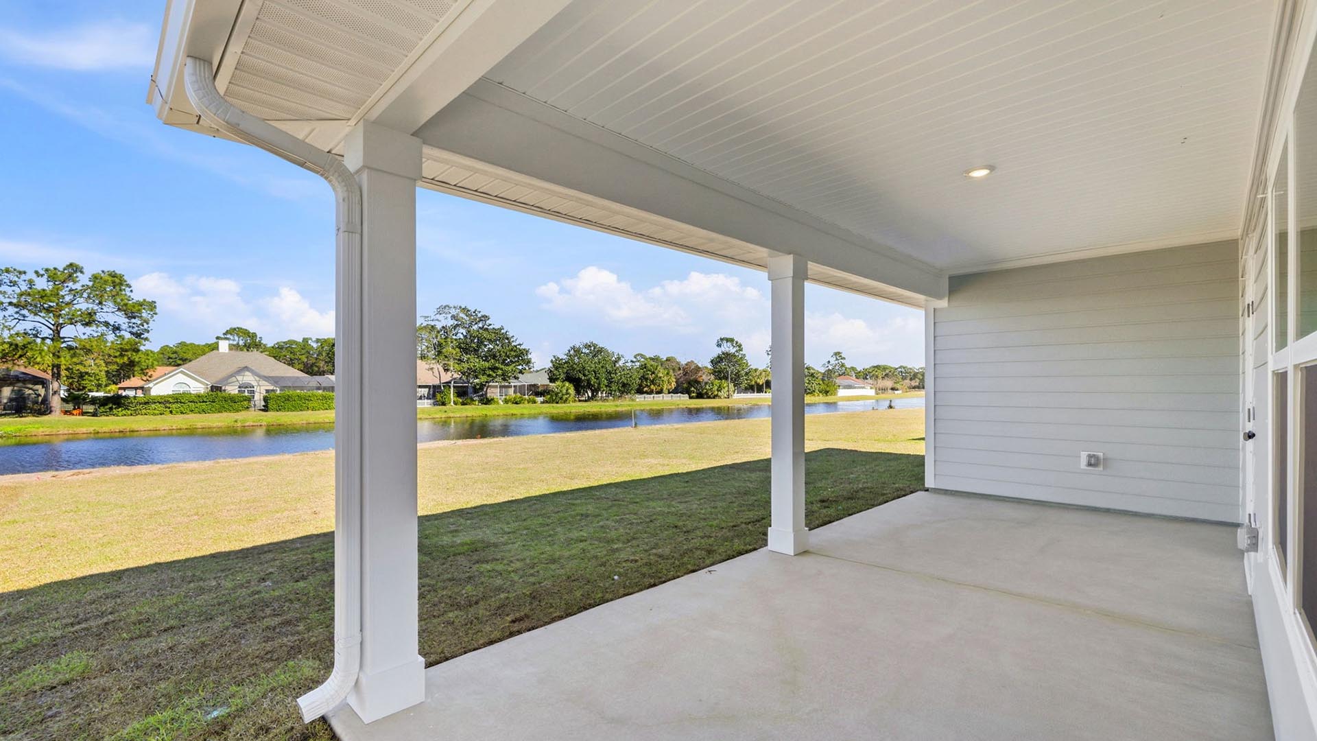 The covered back patio of the Delray is perfect for an outdoor dining area and BBQ