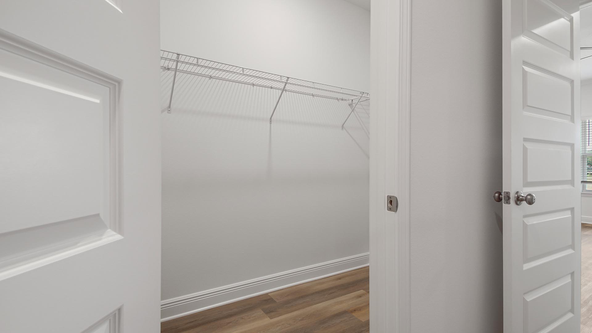 Large closet with upper ventilated shelving