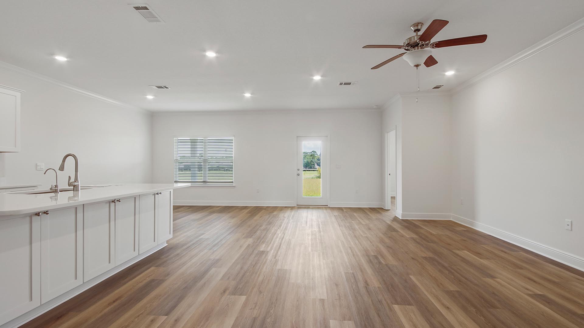 The Delray features an open concept design with ceiling fan and EVP flooring