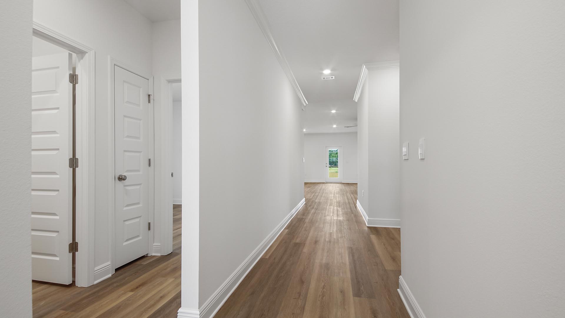 The Delray has a bright entry hall leading to the open concept living area.