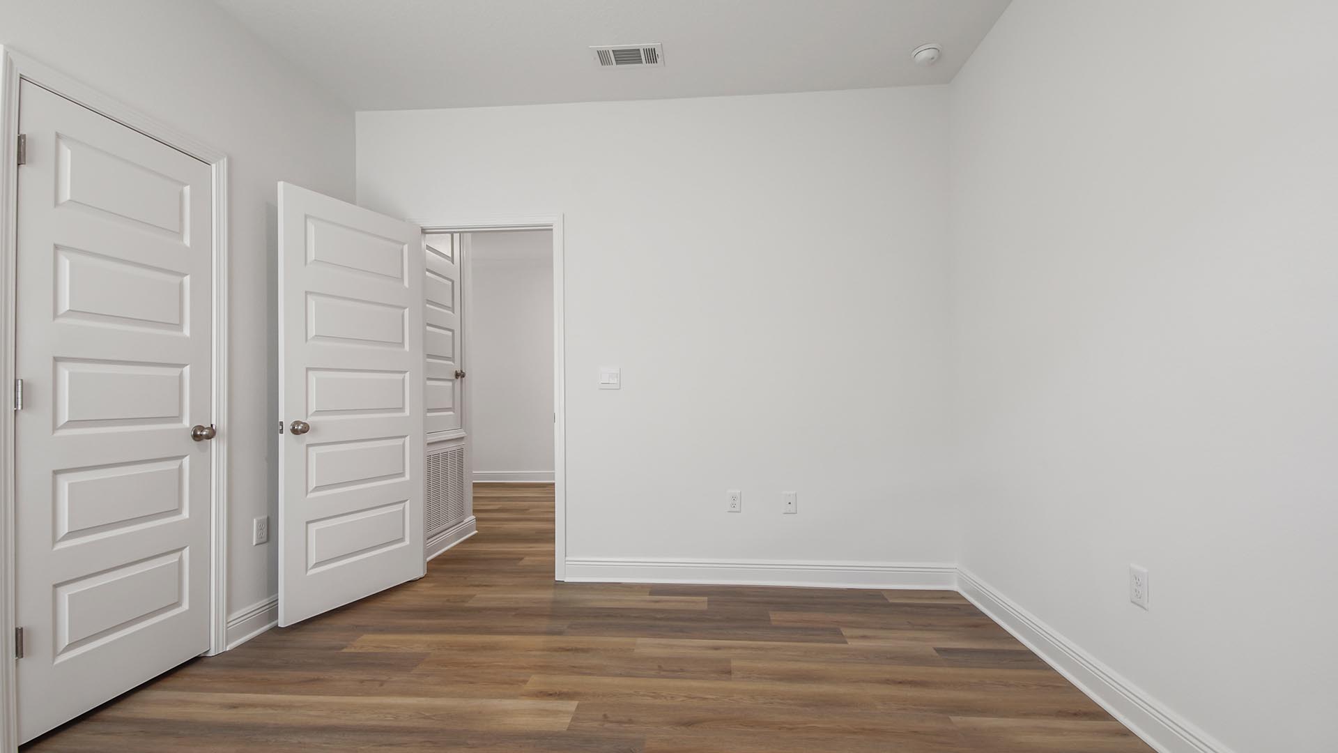 Bedroom four is located off the entry hall and features EVP flooring