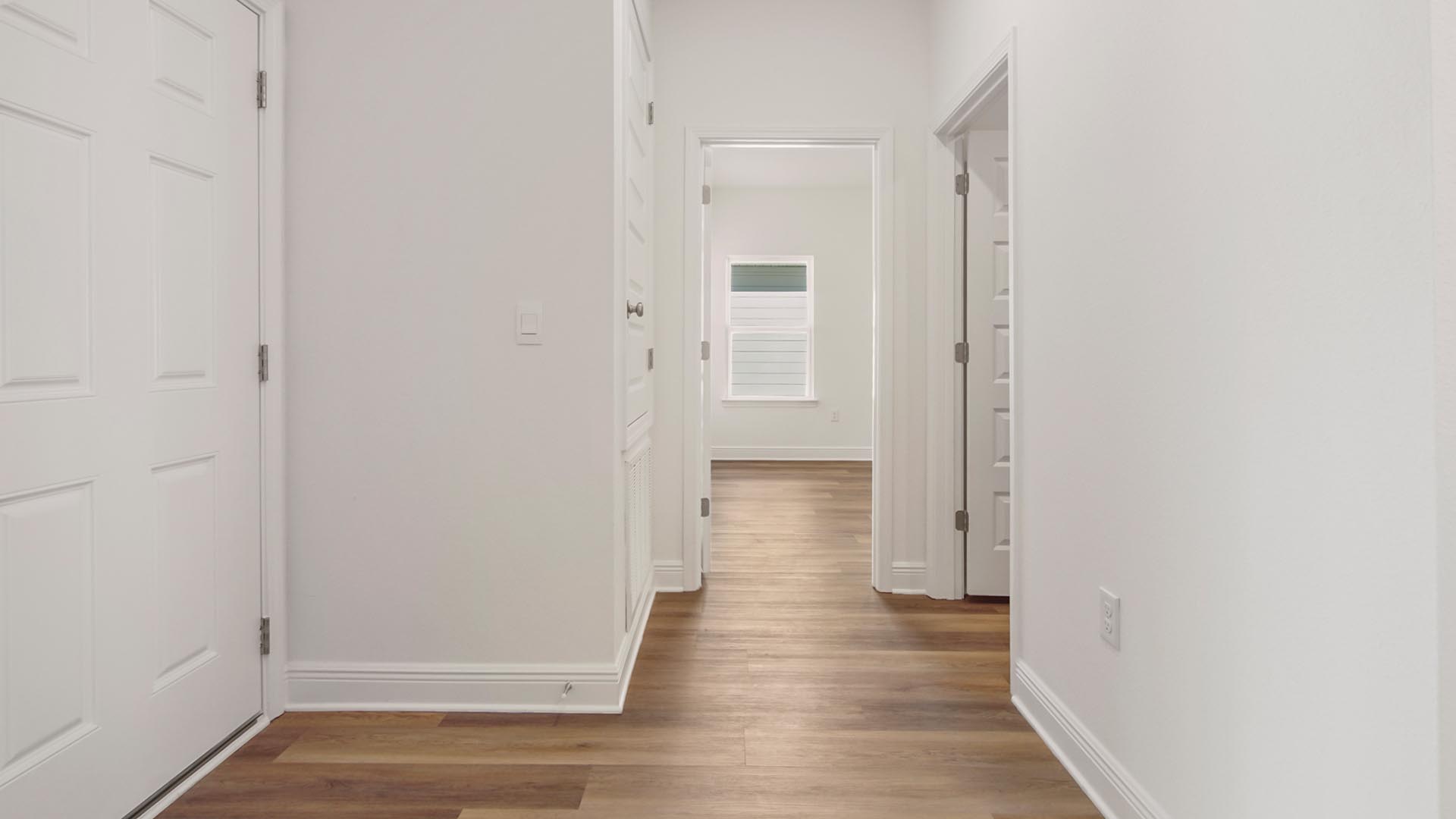 The hall to bedroom four has the laundry room and access to the garage