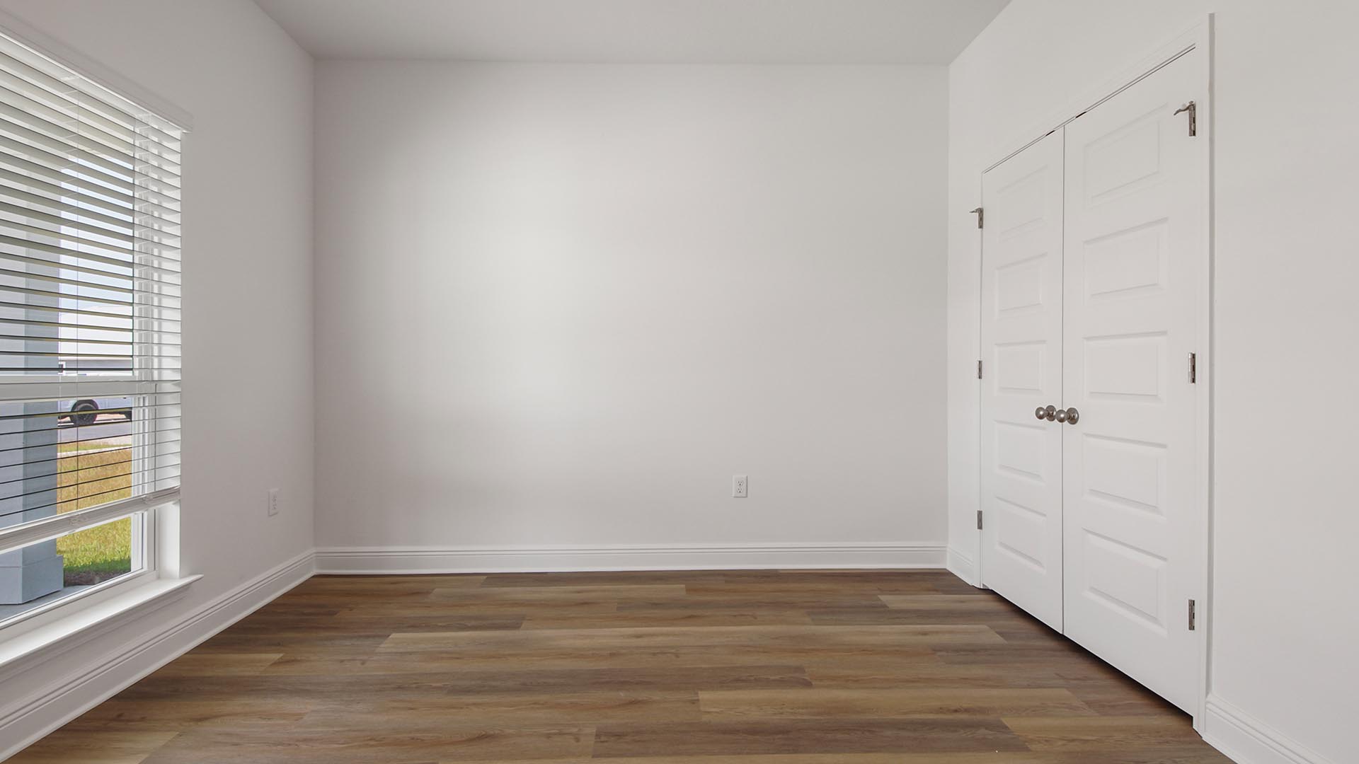 Bedroom two is located overlooking the front lawn