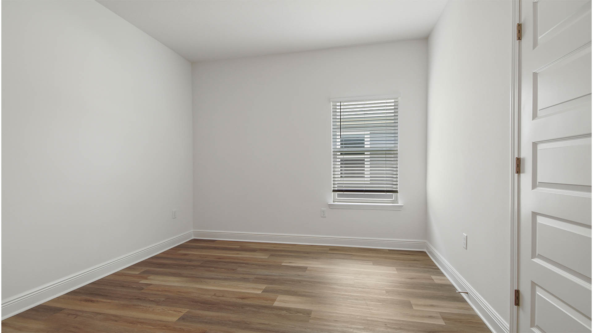 Bedroom four with EVP flooring and window.