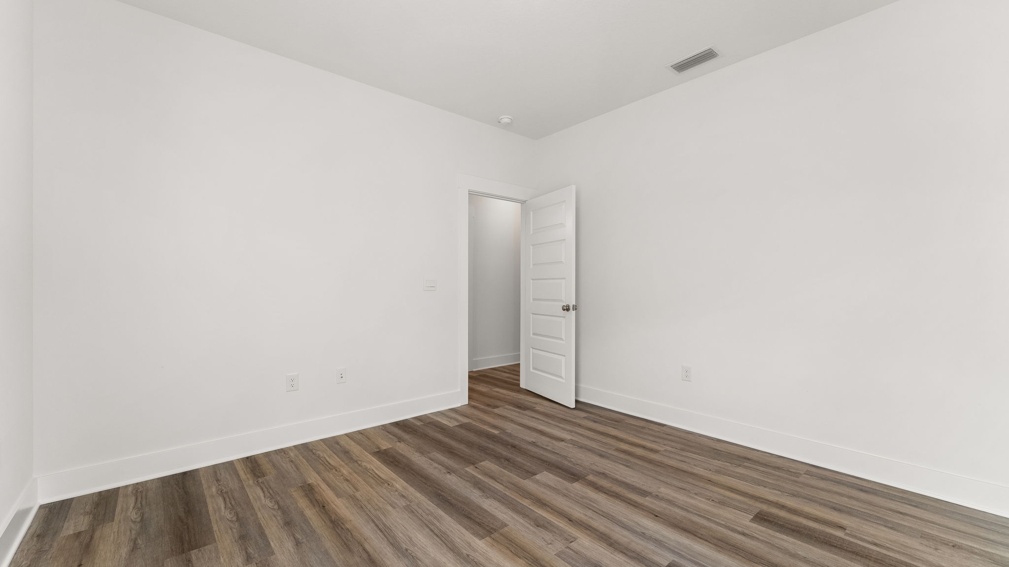 Two guest bedrooms are located off the front entry hall