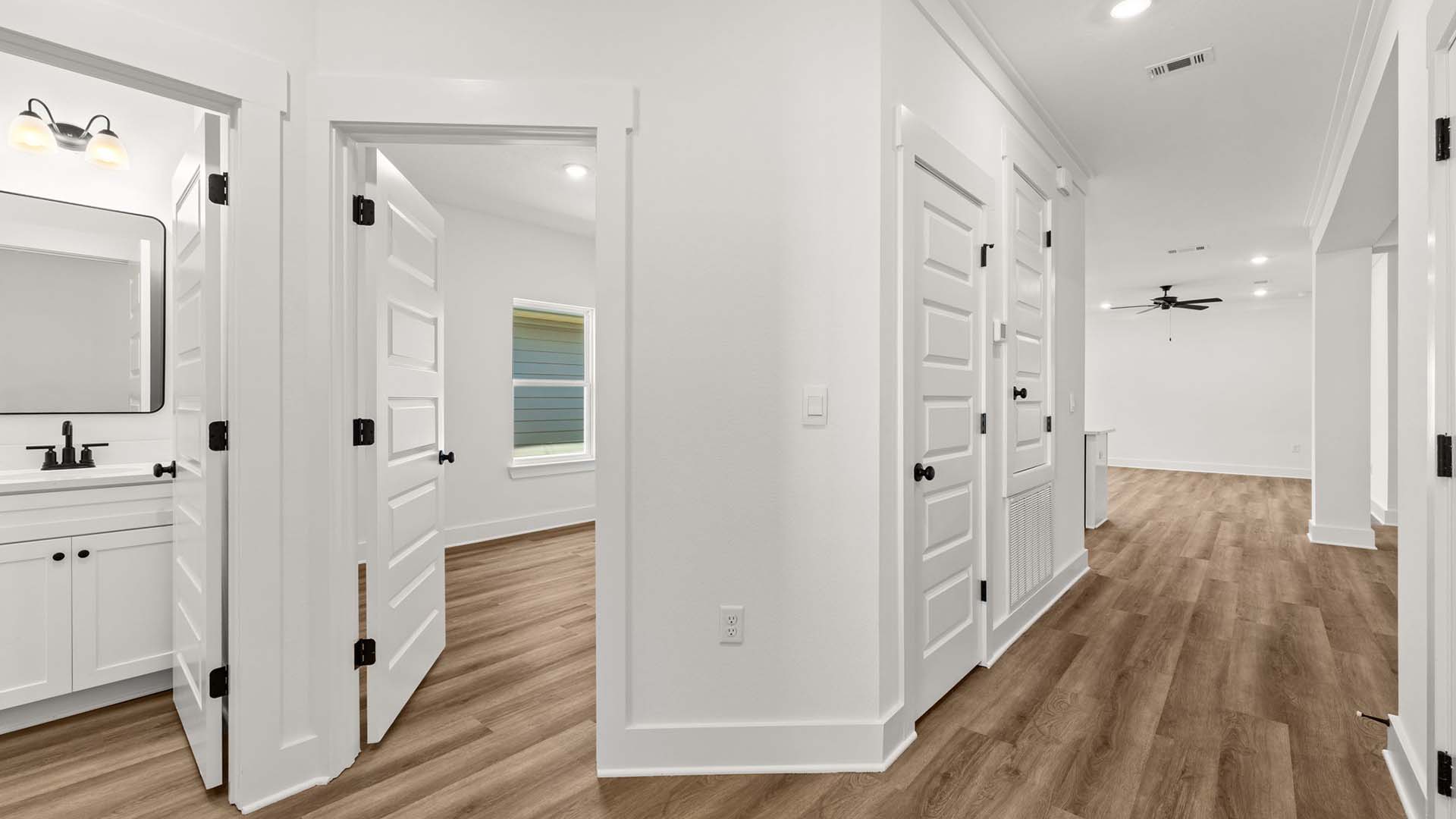 Entry hall to the open concept living space with EVP flooring