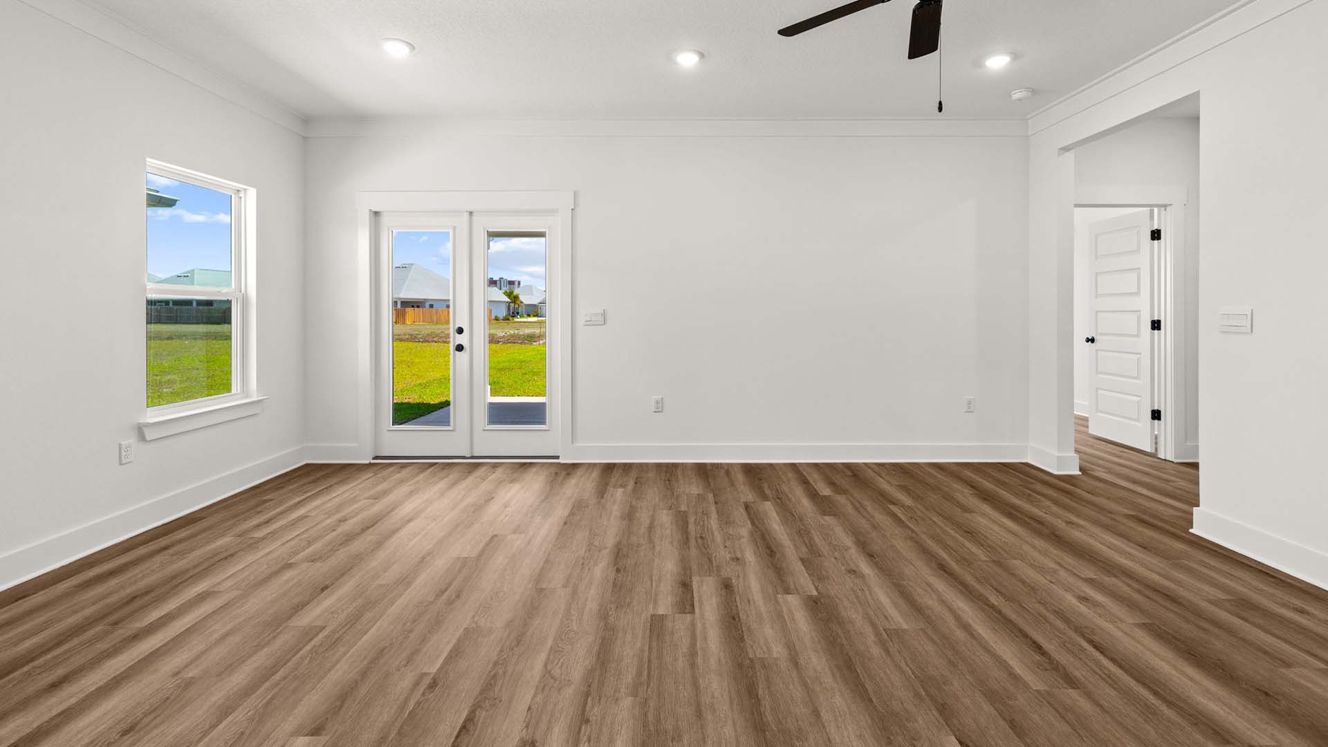 The living area offers access to the patio