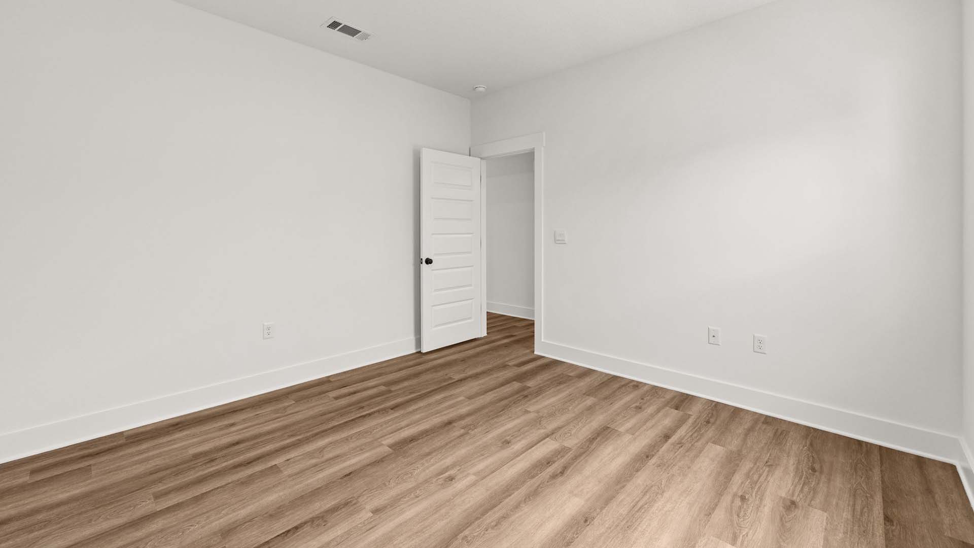 Bedroom five has EVP flooring