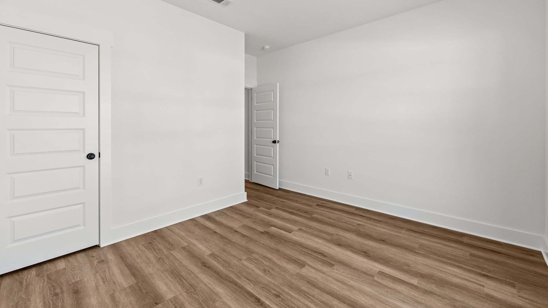 Guest bedroom three has EVP flooring
