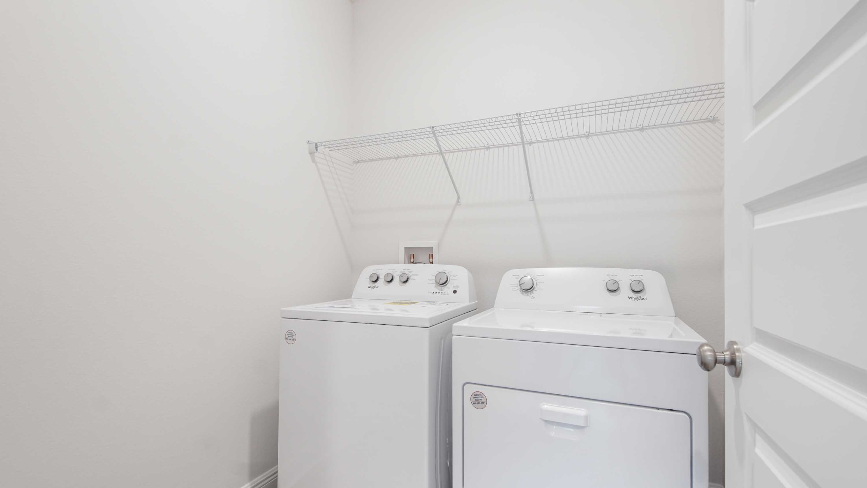 Laundry room entrance facing away from living area.