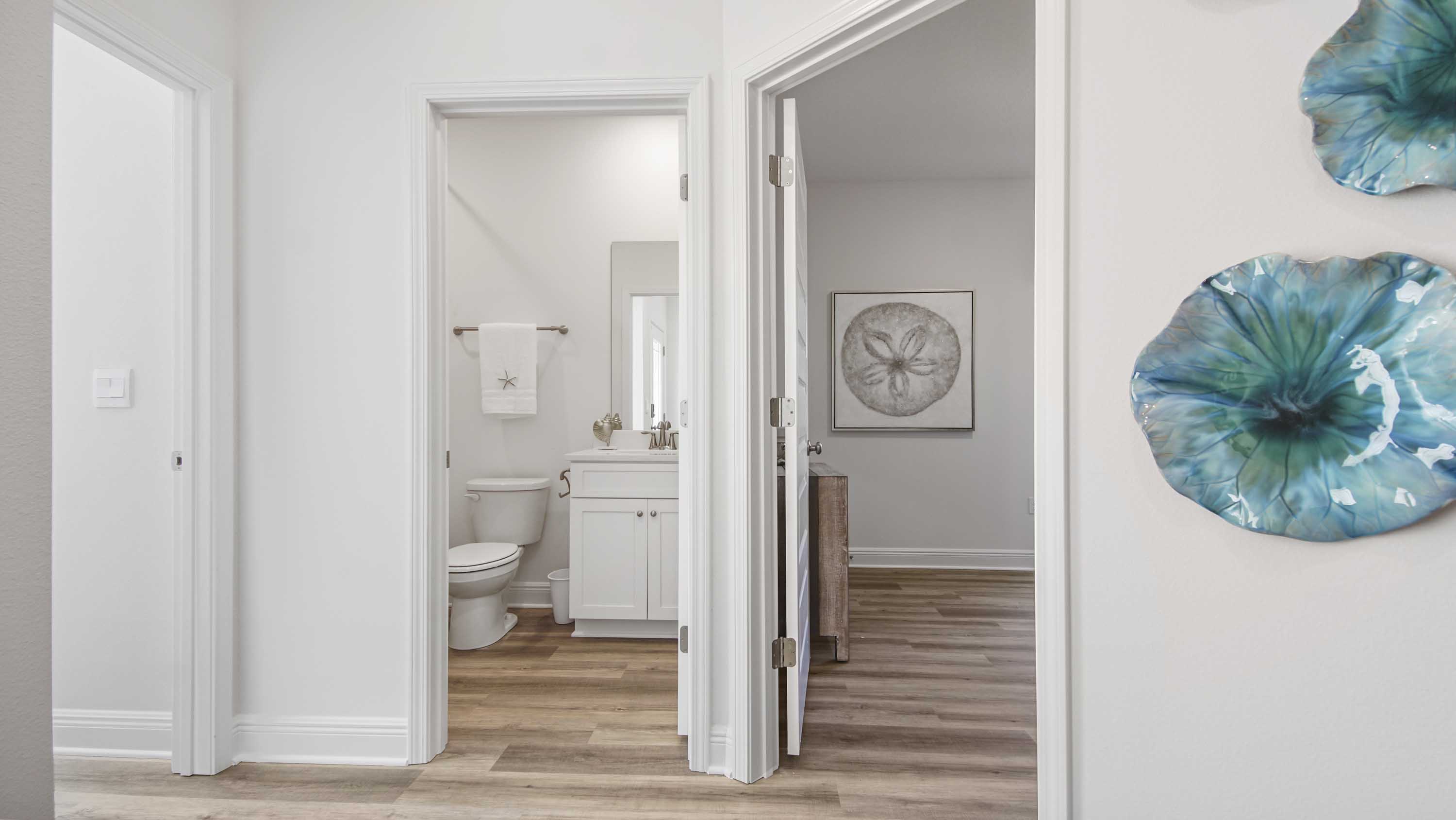 Hallway by front door to bedrooms and bathroom.